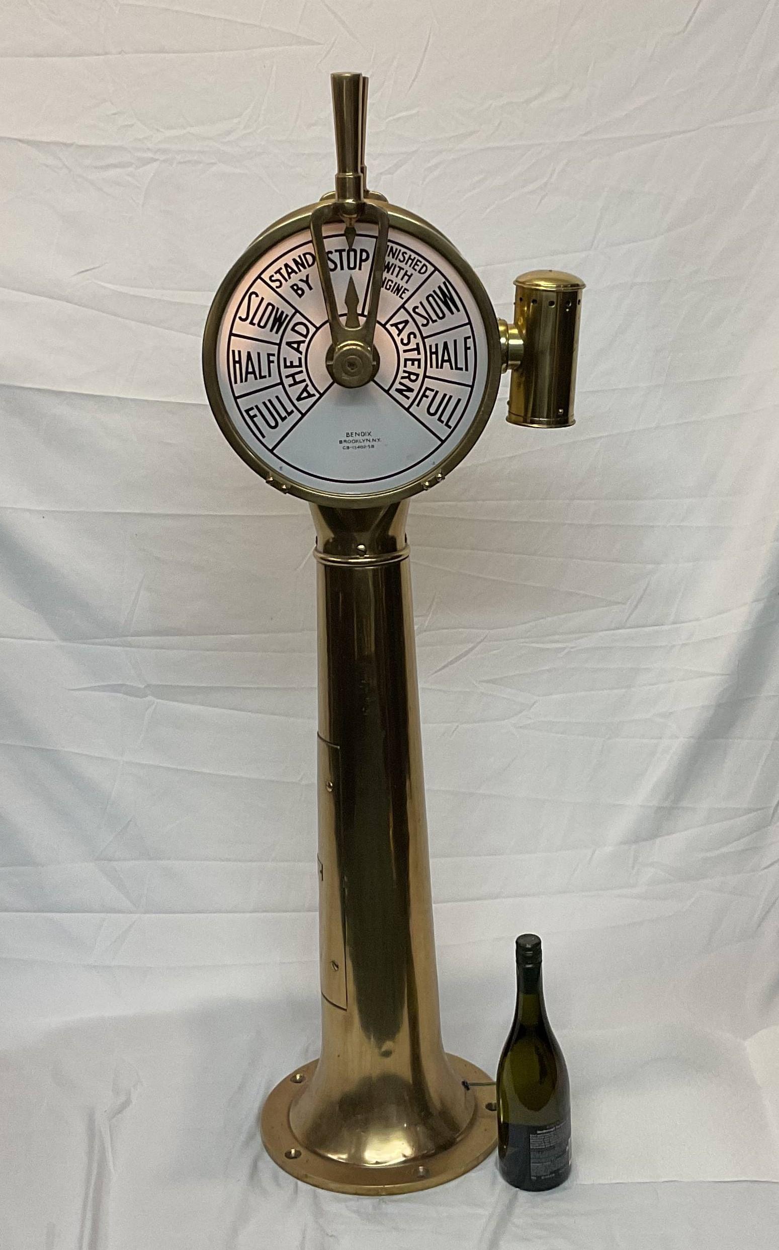 Polished brass ships engine order telegraph by Bendix of Brooklyn N.Y. Serial number CB-13402-5A is also shown. Ships commands slow, half, full, stop, astern and ahead are the displayed commands. Very nice condition. In nice old lacquer.

Weight: 96