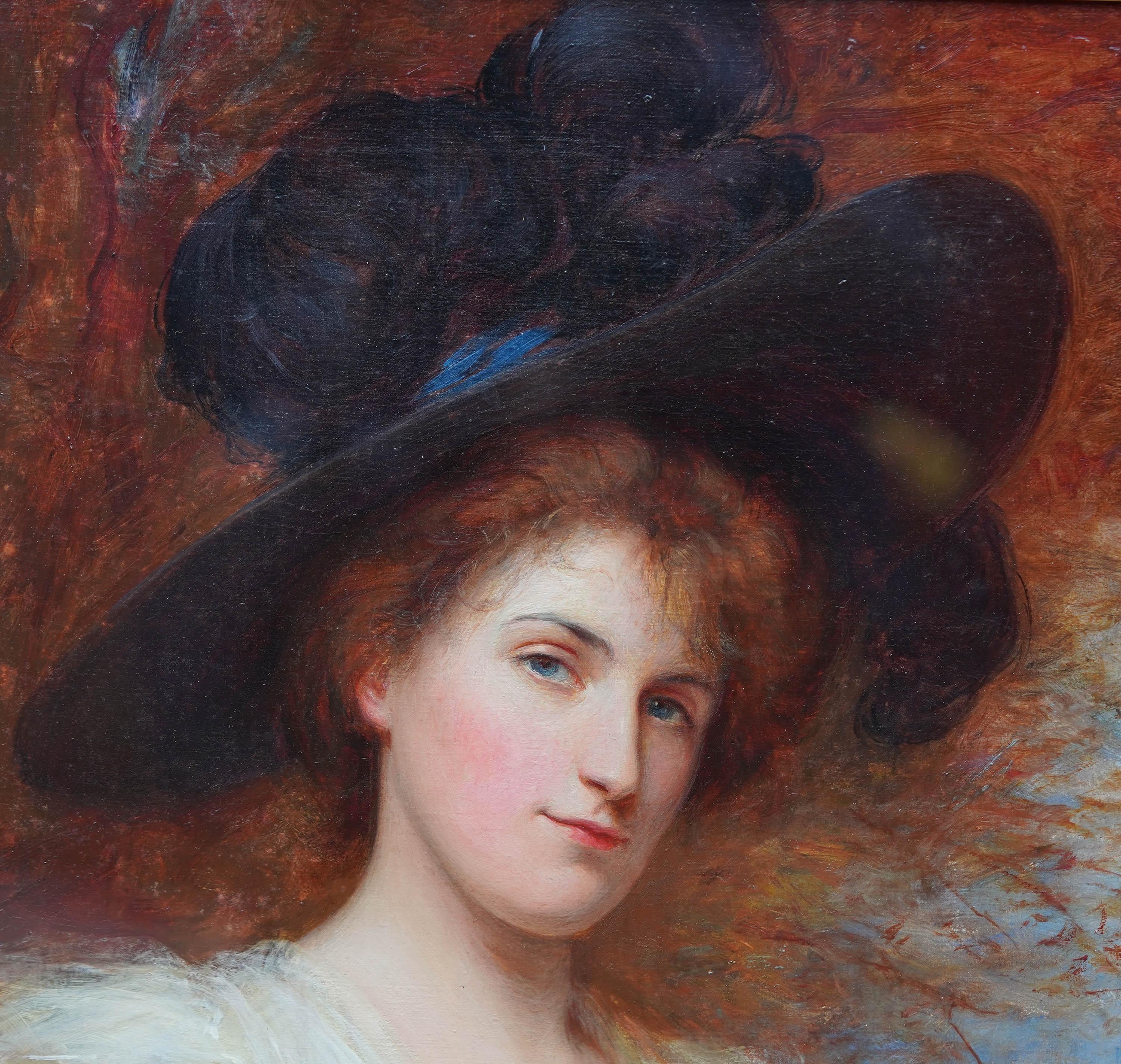 This striking British Edwardian portrait oil painting is by artist Shirley Slocombe. He painted it in 1901 and it is signed and dated lower right. The composition is a bust length portrait of a lady in a landscape. She is wearing a white lacey dress