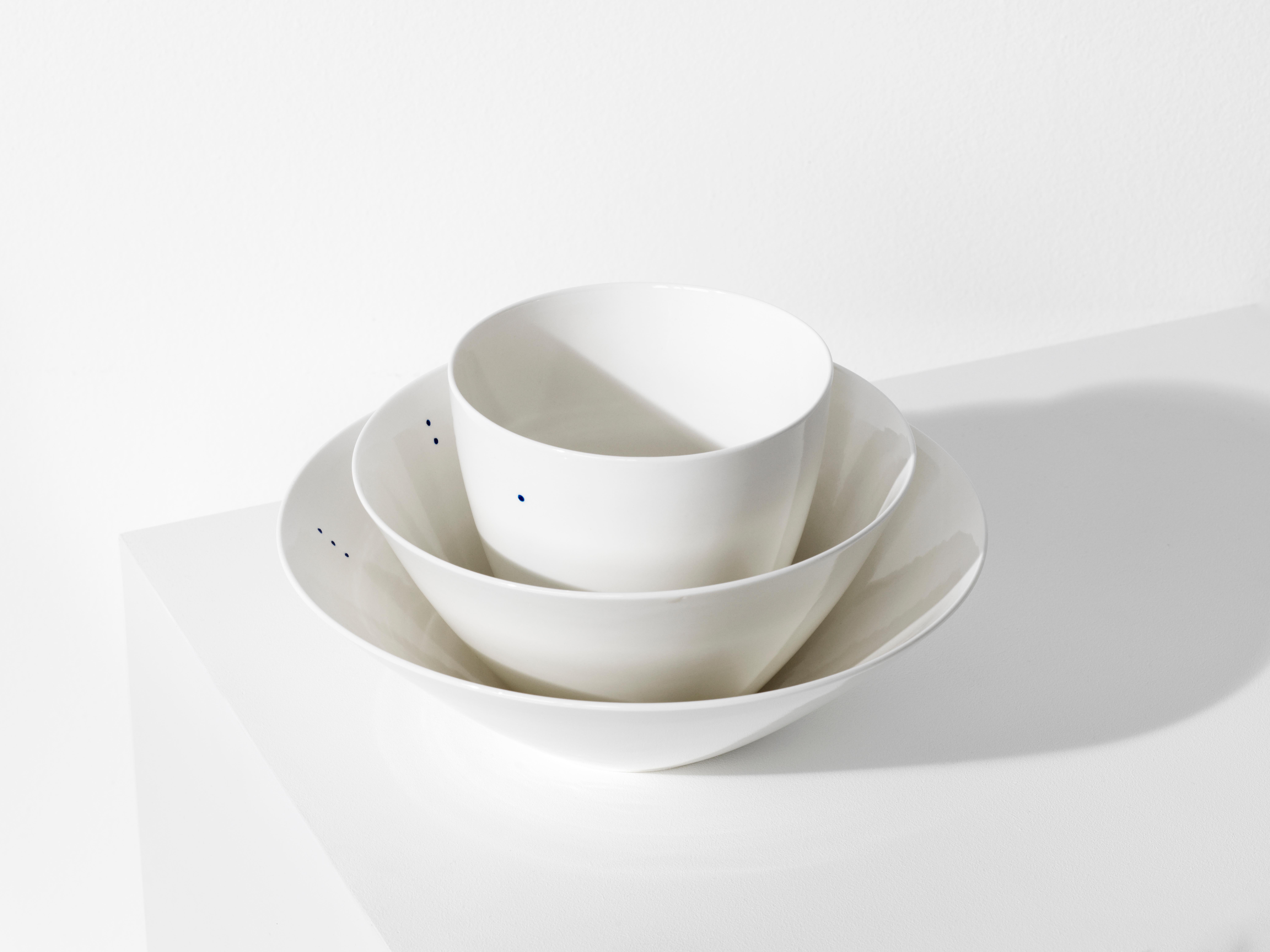 SHIRO is a collection of simple and sculptural bowls that are designed to contain all kinds of foods and drinks. Each of the three shapes comes in two sizes – a small and a large. 

Shiro is the Japanese word for white. The little indigo blue dot is