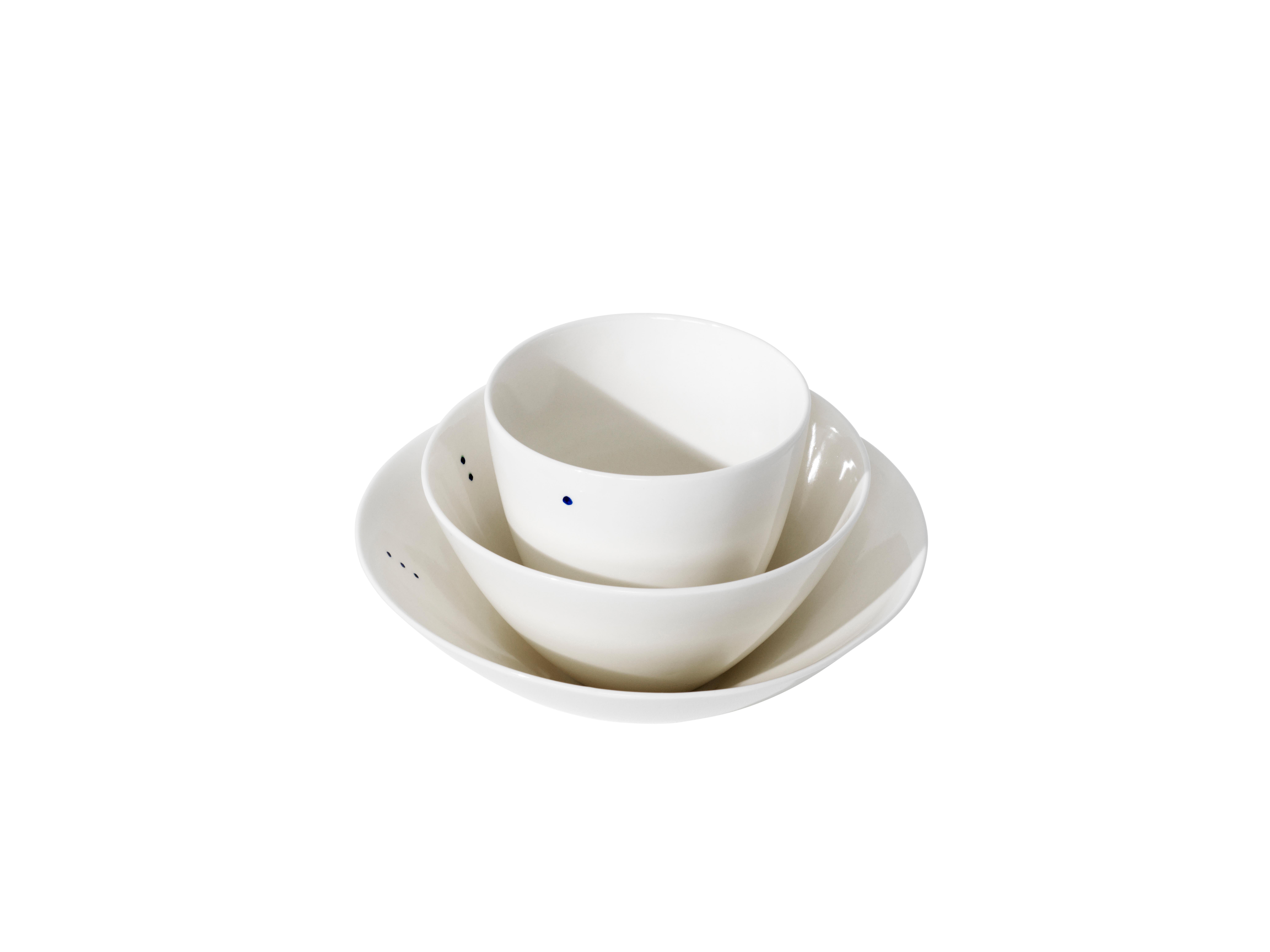 SHIRO is a collection of simple and sculptural bowls that are designed to contain all kinds of foods and drinks. Each of the three shapes comes in two sizes – a small and a large. 

Shiro is the Japanese word for white. The little indigo blue dot is