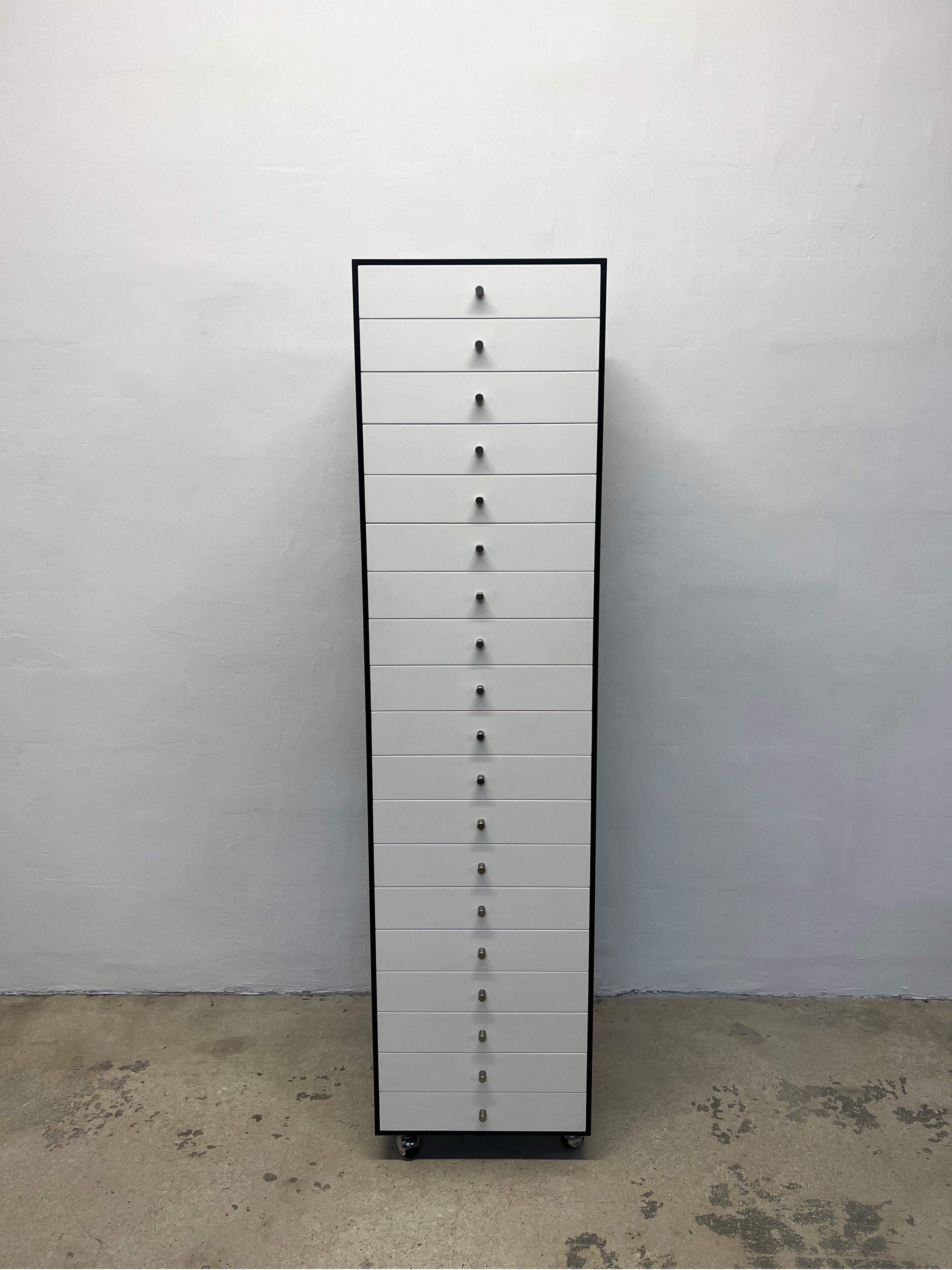 This rare 19 drawer cabinet by the renowned Japanese designer Shiro Kuramata is a true masterpiece of contemporary furniture design. Crafted with exquisite attention to detail, the cabinet features 19 spacious white laminate drawers housed within a