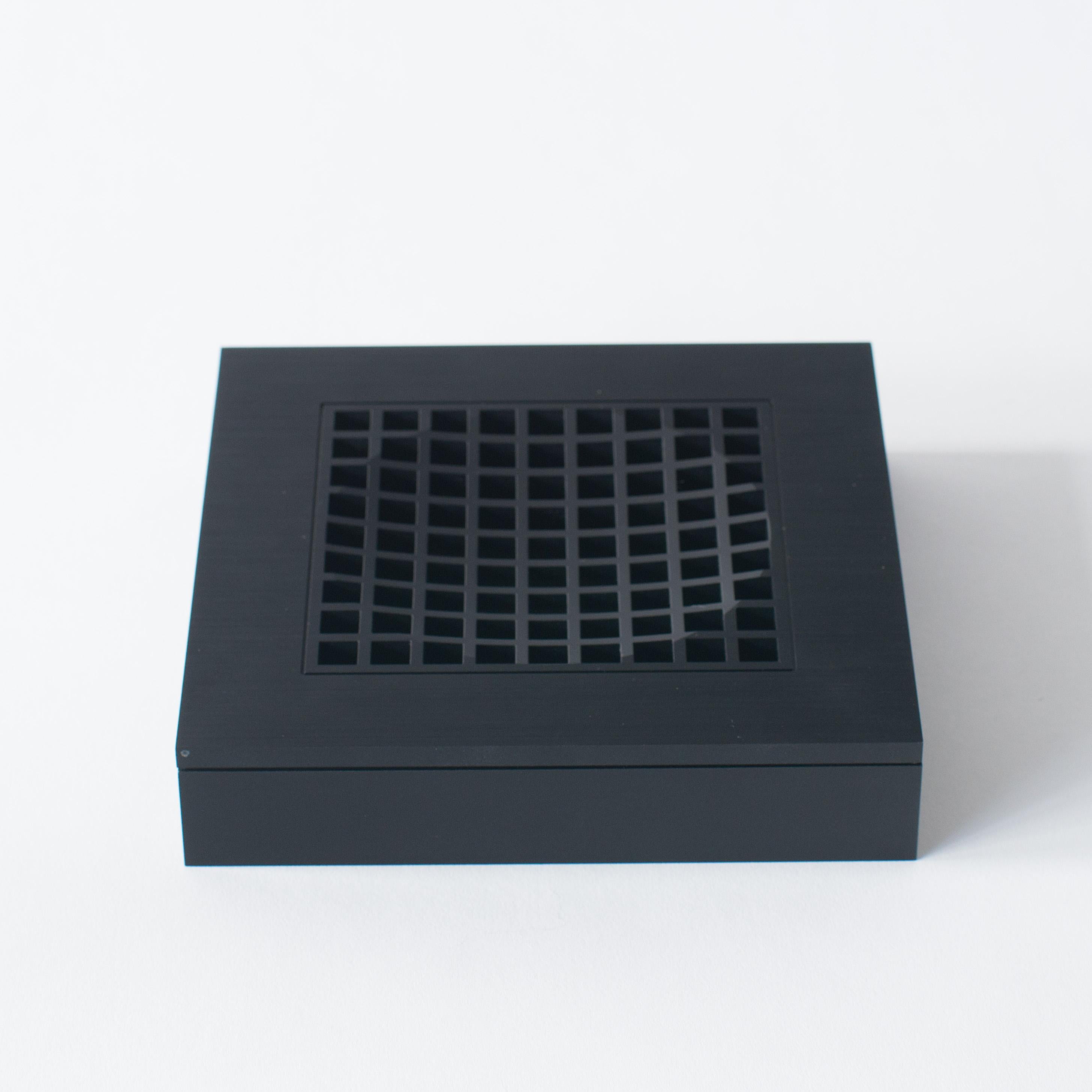 Shiro Kuramata's ashtray1. Made of black aluminum.
Rather optical art object than usual astray. 


  
  