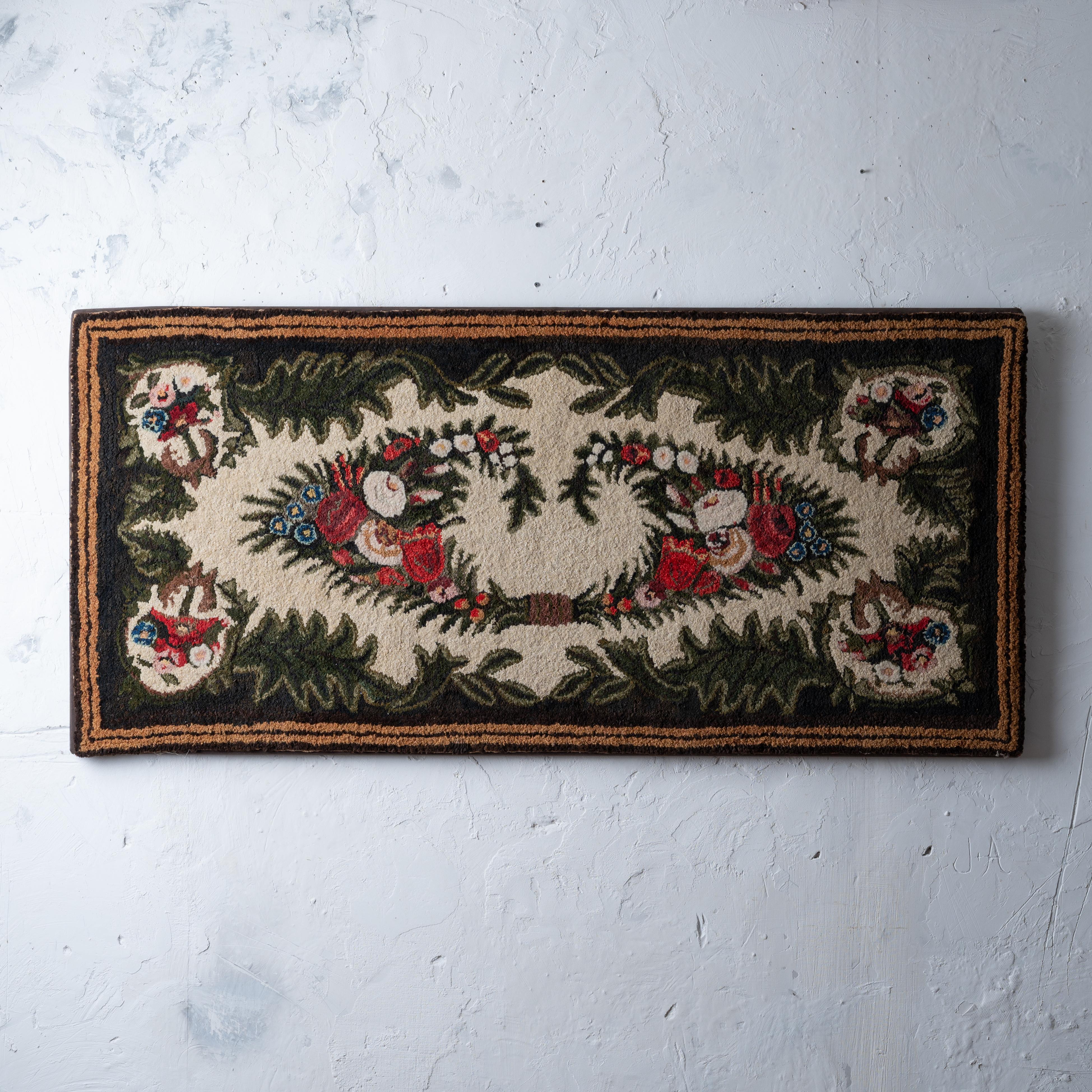 A floral shirred rug, New England, circa 1850.
Professionally mounted on stretched canvas frame.

67 by 32 inches


