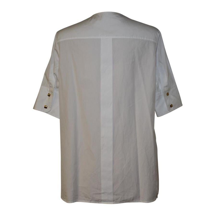 missing composition tag White color Front insert made of piquet Button closure Short sleeves Lenght from shoulder cm 68 (26.77 inches) Shoulders cm 38 (14.96 inches)
