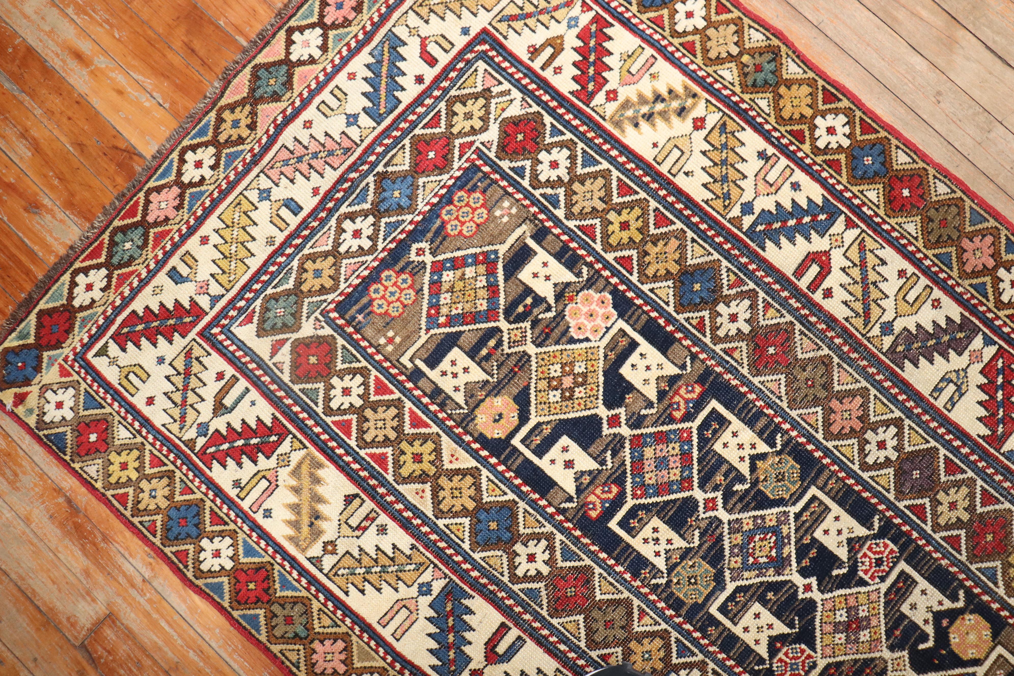 A late 19th-century tribal connoisseur level Caucasian Shirvan Runner. Rust, ivory, brown dominant accents on a striated navy ground.

Measures: 2'11
