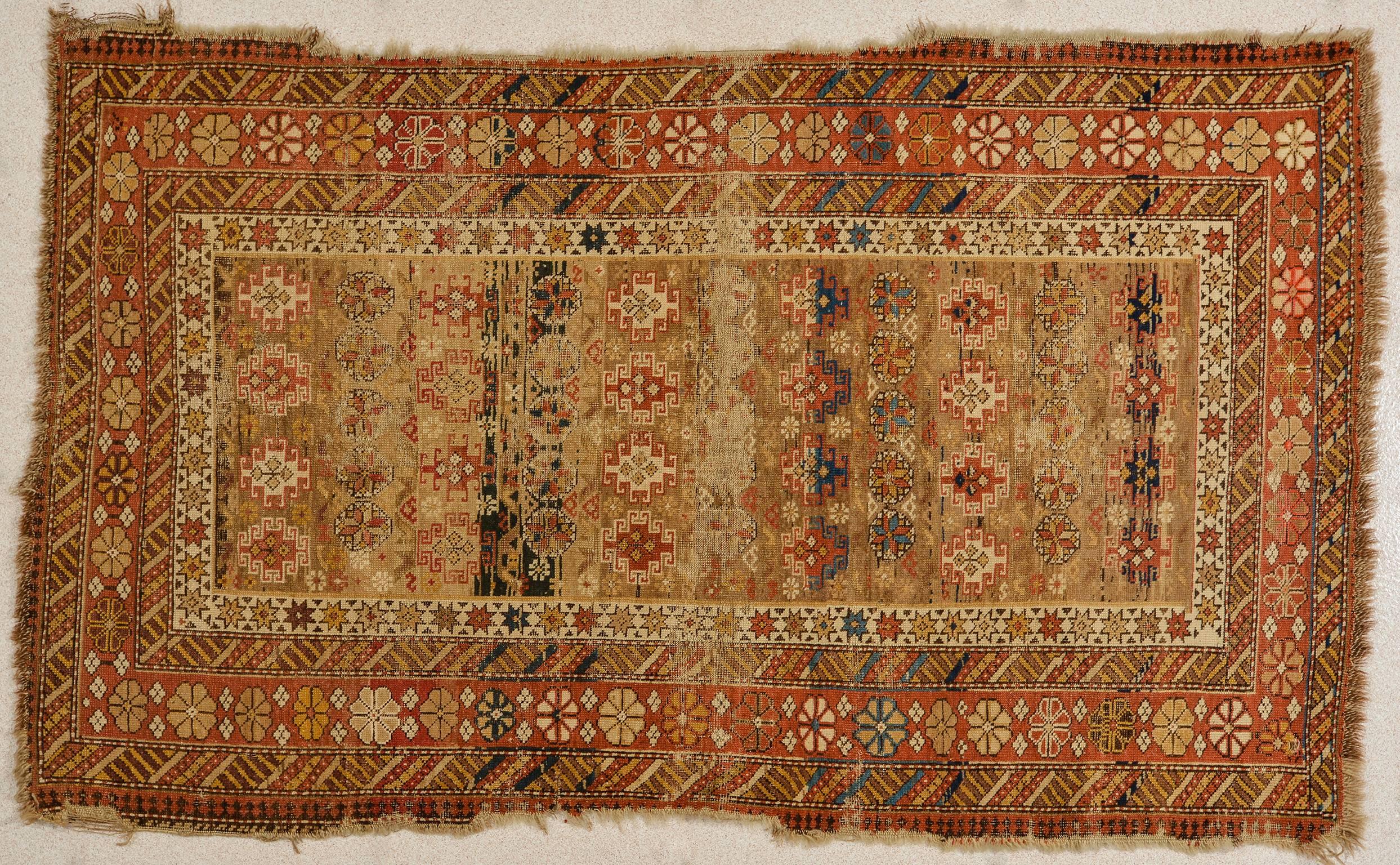 Rare design of the Chi Chi motif for this antique Shirvan rug fragment, suitable for wall also: already prepared to adhere (with velcro) to a frame or a wall panel. Beautiful elegant camel color -
Nr. 1337.