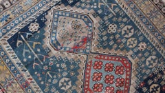 Shirvan Kazak with Soft Blue Field, Neutral Designs and Red Medallions c.1900