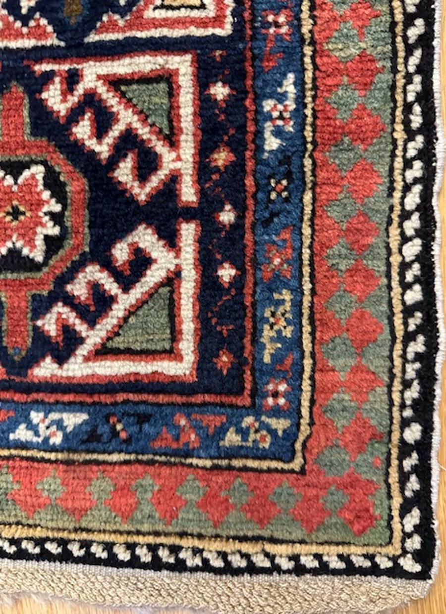 Shirvan long rug from eastern Caucasus,west coast of the Caspian Sea

Age: dated 1297=1880

Size: 11′.0″X3′.7″ (335×109 cm)

The navy ground shows openwork floriated botehs in offset rows.The botehs enclose flowers,color sampler diamonds and