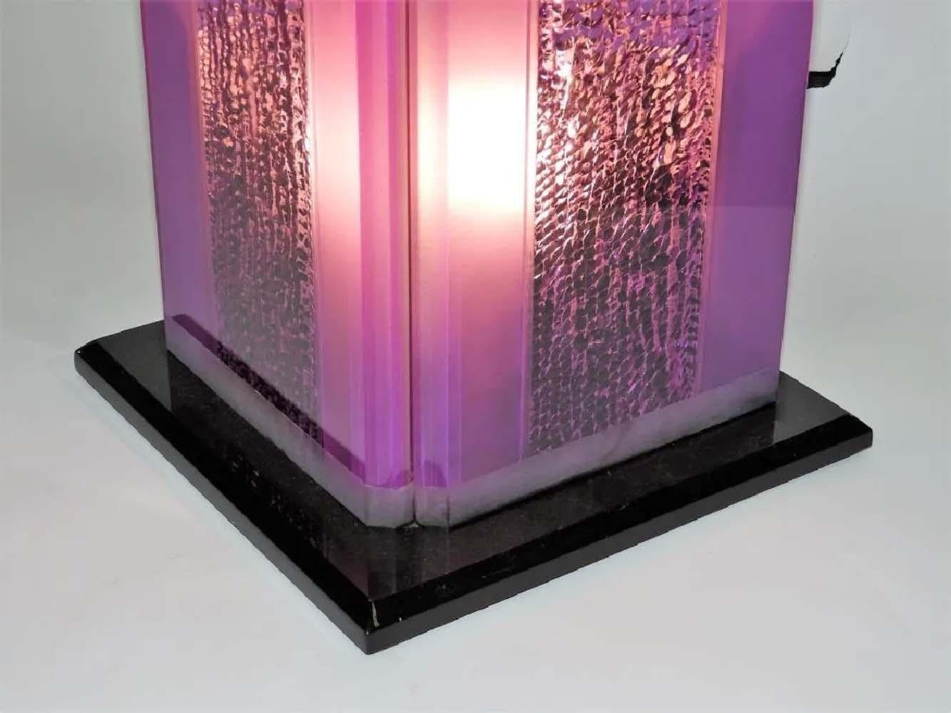 Super cool, colorful and bright, thick purple and black lucite table lamp. Designed by Shlomi Haziza and manufactured by HStudio in Los Angeles circa 1990s. This lamp features a polished exterior surface with a carved or chipped away interior that