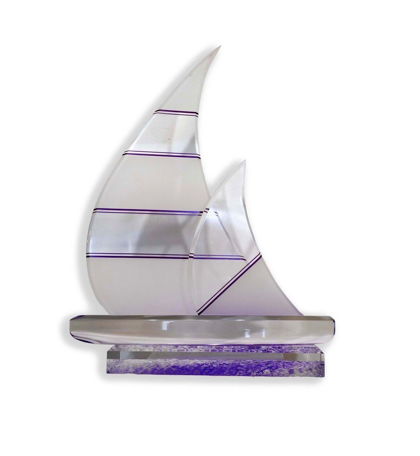 The Shlomi Haziza Lucite Purple and Clear Sailboat Sculpture is a mesmerizing example of contemporary modern art, combining intricate craftsmanship with a unique visual experience. Crafted by the acclaimed artist Shlomi Haziza, this sculpture