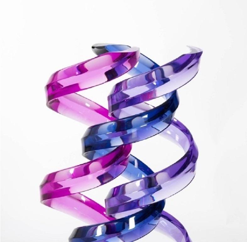 Awesome triple helix abstract sculpture created by contemporary Israeli artist Shlomi Haziza circa 1990. Intertwined pink, violet, and blue faceted acrylic ribbons, displayed on a clear lucite stand. Signed by the artist at the base.

