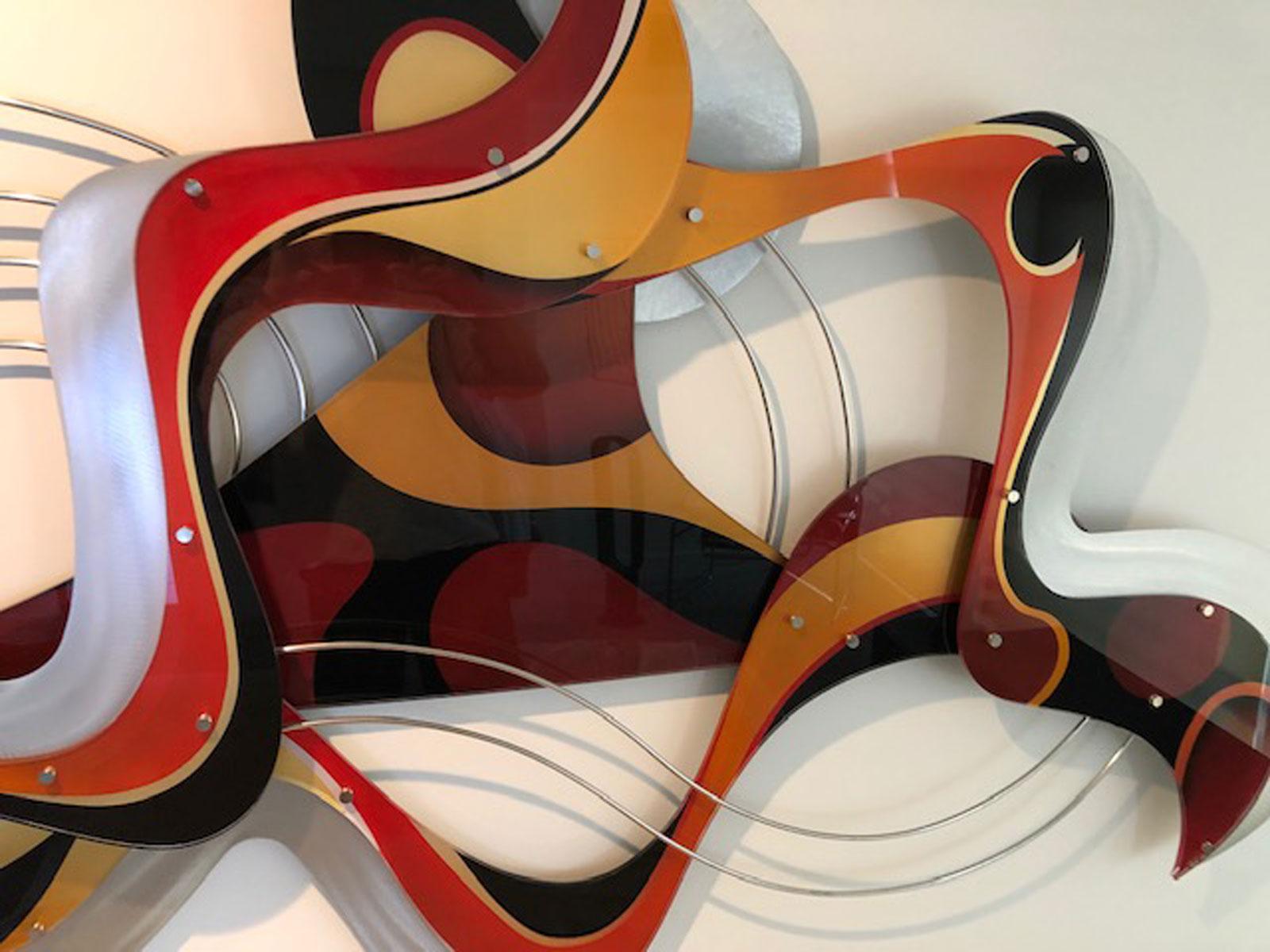 A large modern acrylic and metal wall sculpture by Israeli artist Shlomi Haziza. Crisp, geometric design featuring intense flowing colors. Singed by the artist. Elegant modern decorative wall piece. Perfect for any large wall in need of a flowing,