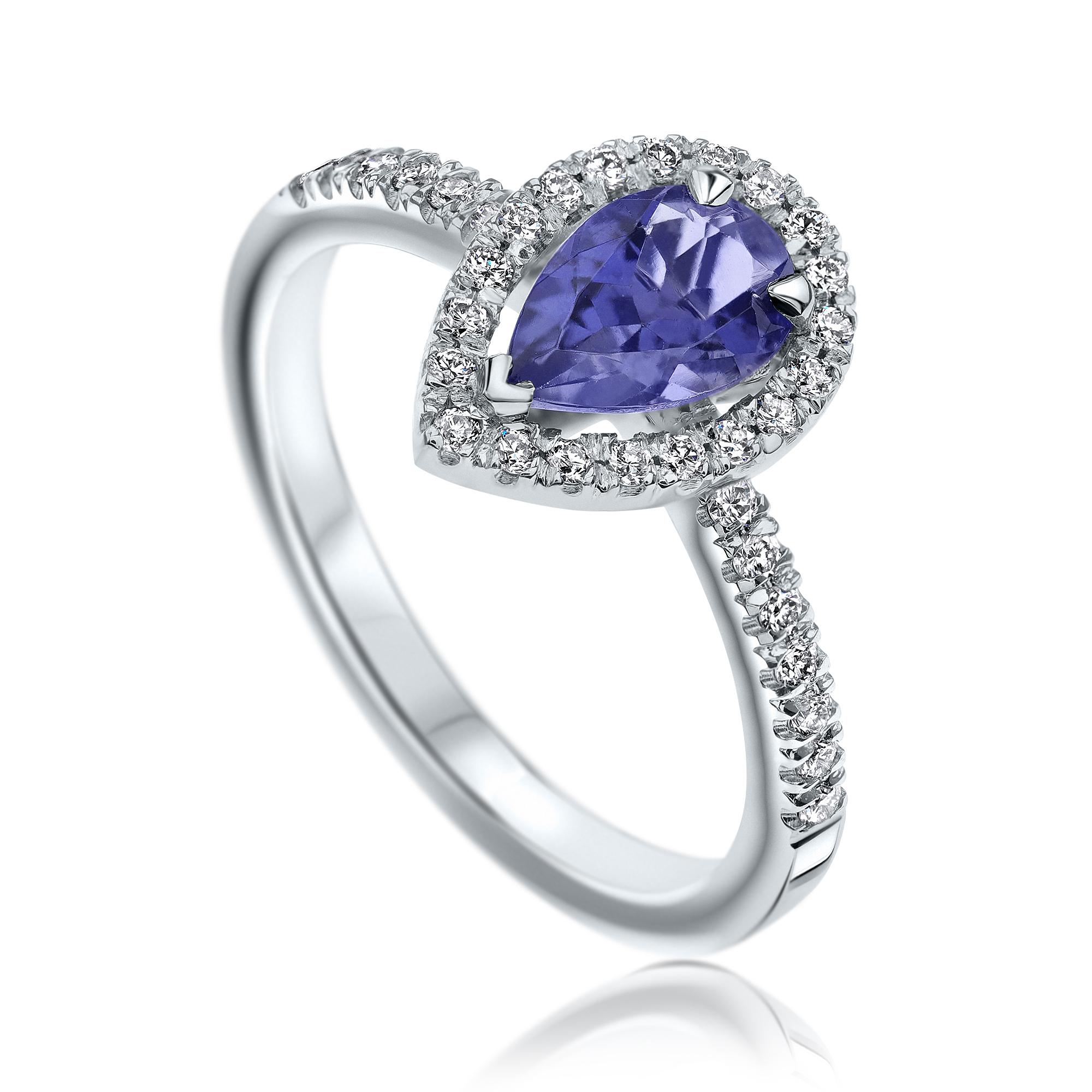 Shlomit Rogel - Pear Tanzanite & Diamonds Ring in 14K in White Gold

Pear shaped tanzanite halo style diamond ring, set with a purplish-blue clear 0.60 carat natural tanzanite gemstone. 

In the ring there are additional 36 diamonds diamonds set in