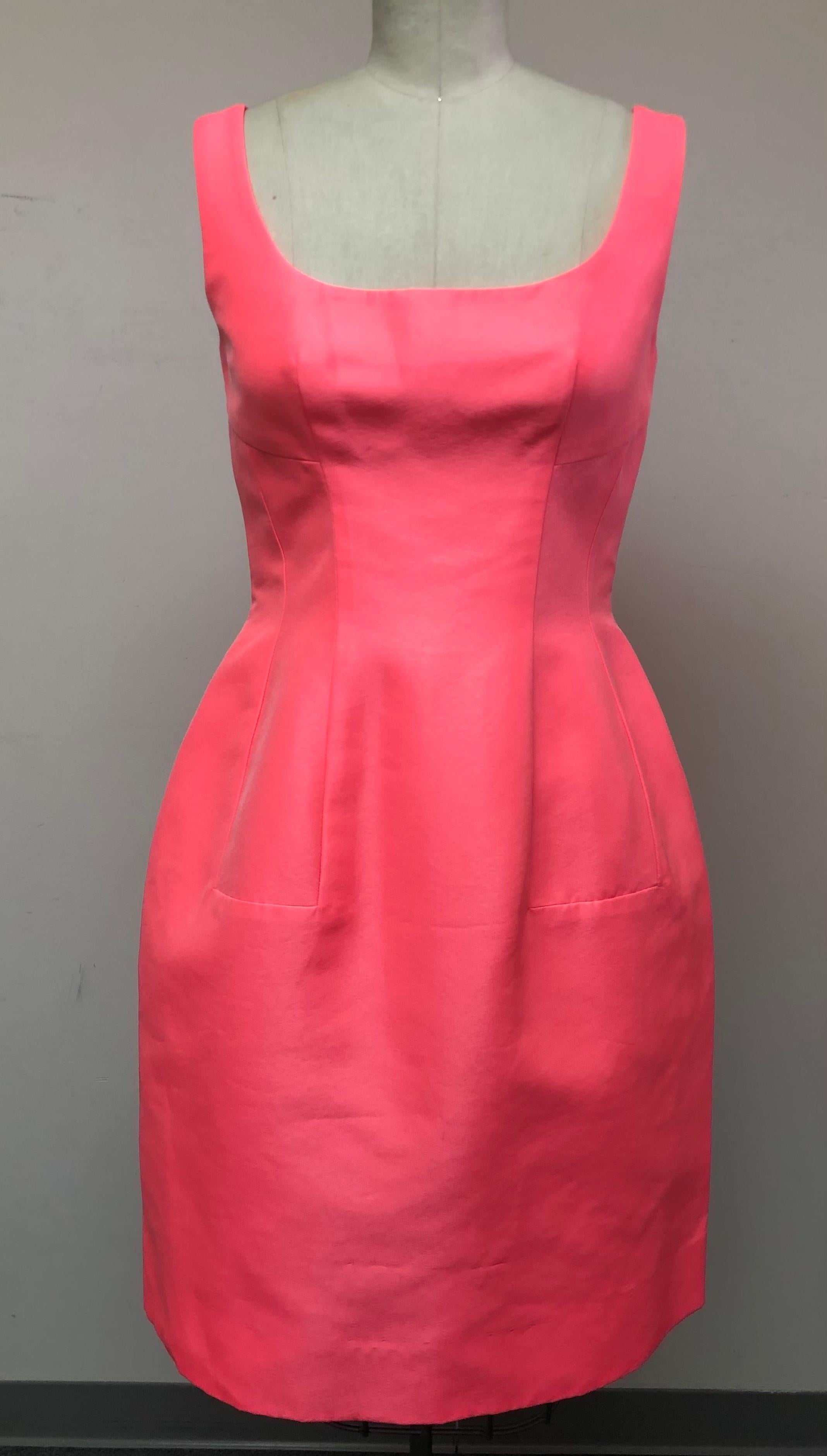 The Color of this Dress is Sublime. Shocking Pink Silk from Italy. Sleeveless with scoop neckline. The skirt has a lovely fullness with 
insets giving it a unique look.
Worn for cocktails or out to dinner on a summery night or as a wedding guest.