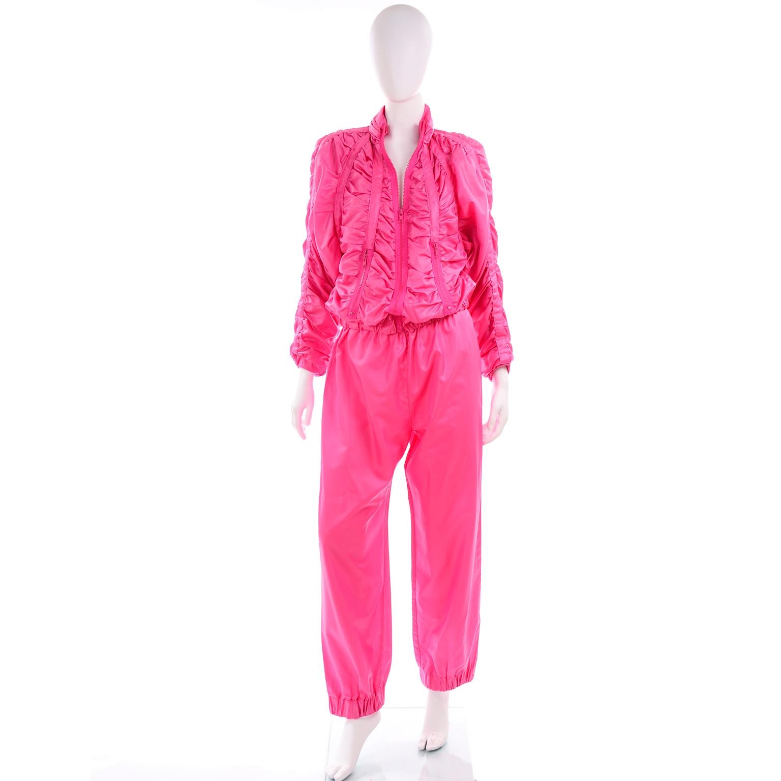 This vintage 1980's tracksuit designed by Antonio Ruspoli is truly one of our favorite athleisure outfits! The zip front sweatshirt style jacket has panels that are gathered to create a ruching effect. There are dolman style sleeves, a gathered