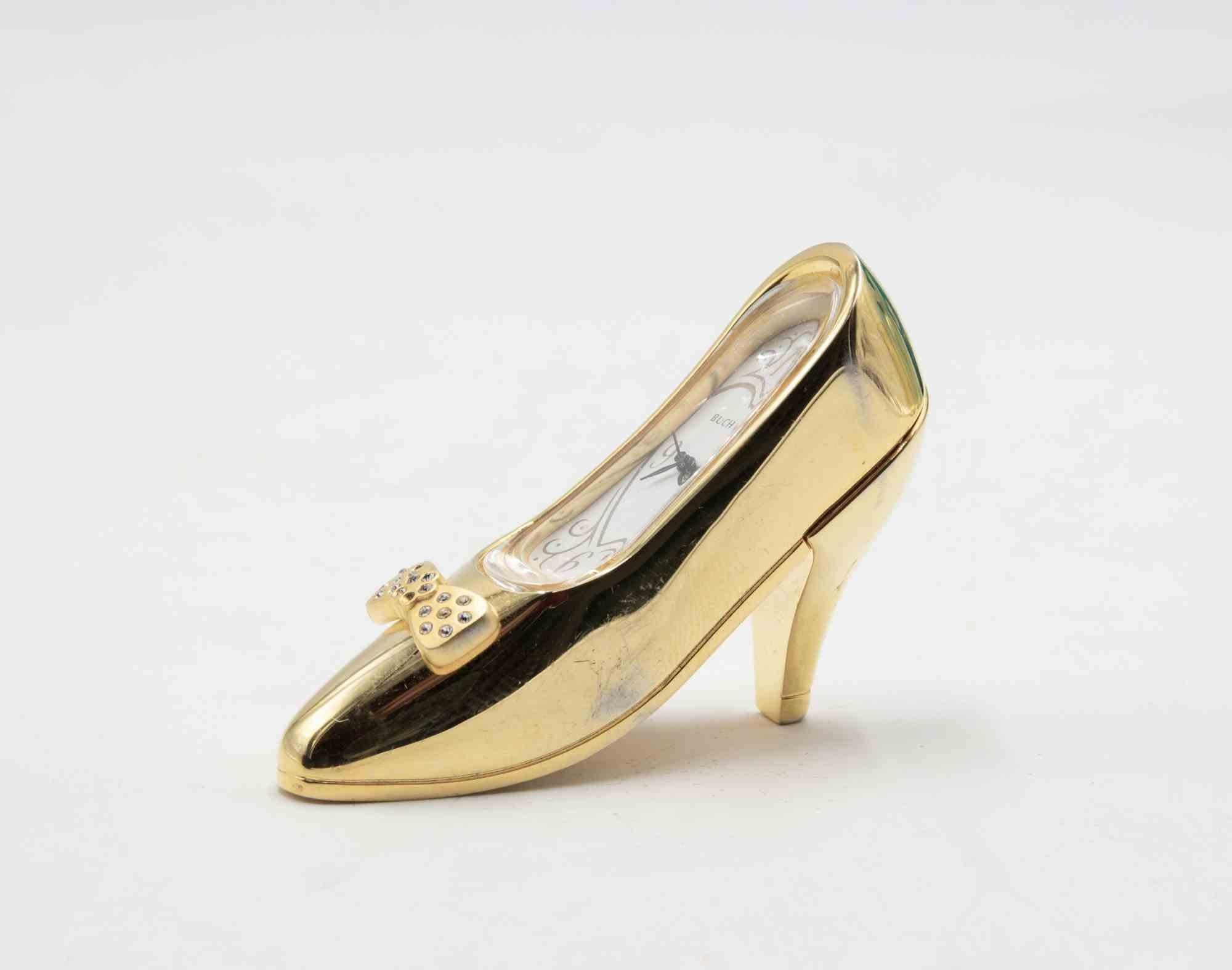 Shoe-Clock realized by Bucherer in 1970s. 

Metal and Glass.