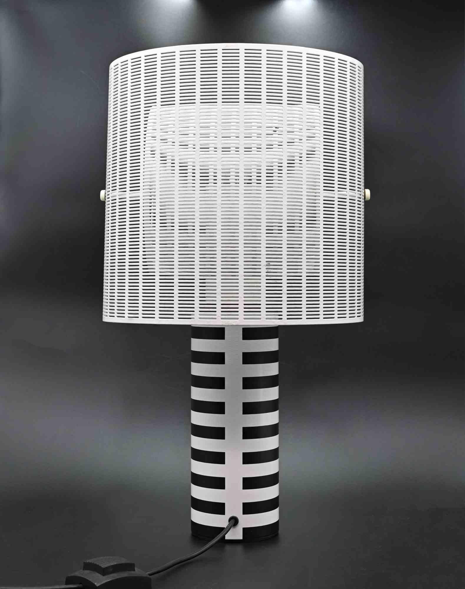 Shogun Table Lamp by Mario Botta for Artemide, 1986 ca.

Embossed cast iron, enamelled metal, enamelled metal grid.

Dimensions H 60 D 30 cm.

Ref. G. Gramigna, Repertorio 1950-2000, Allemandi, Torino, 2003, pag. 374. 

Very good general condition.