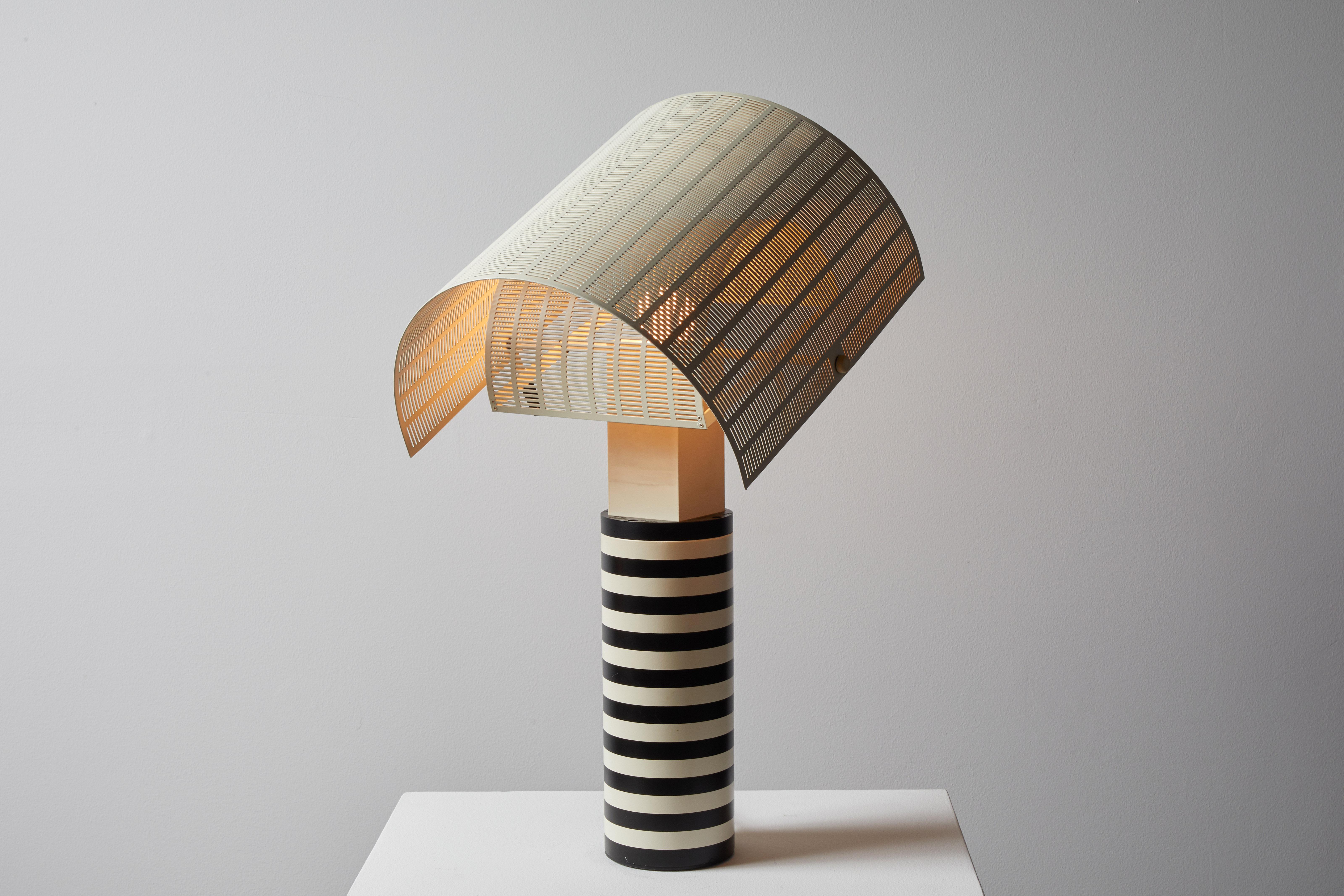 Shogun table lamp designed by Mario Botta for Artemide in Italy, 1986. Enameled aluminum, steel and acrylic. Original cord. Metal diffusers adjust independently. Takes one E27 100w maximum bulb. Bulbs provided as a one time courtesy.