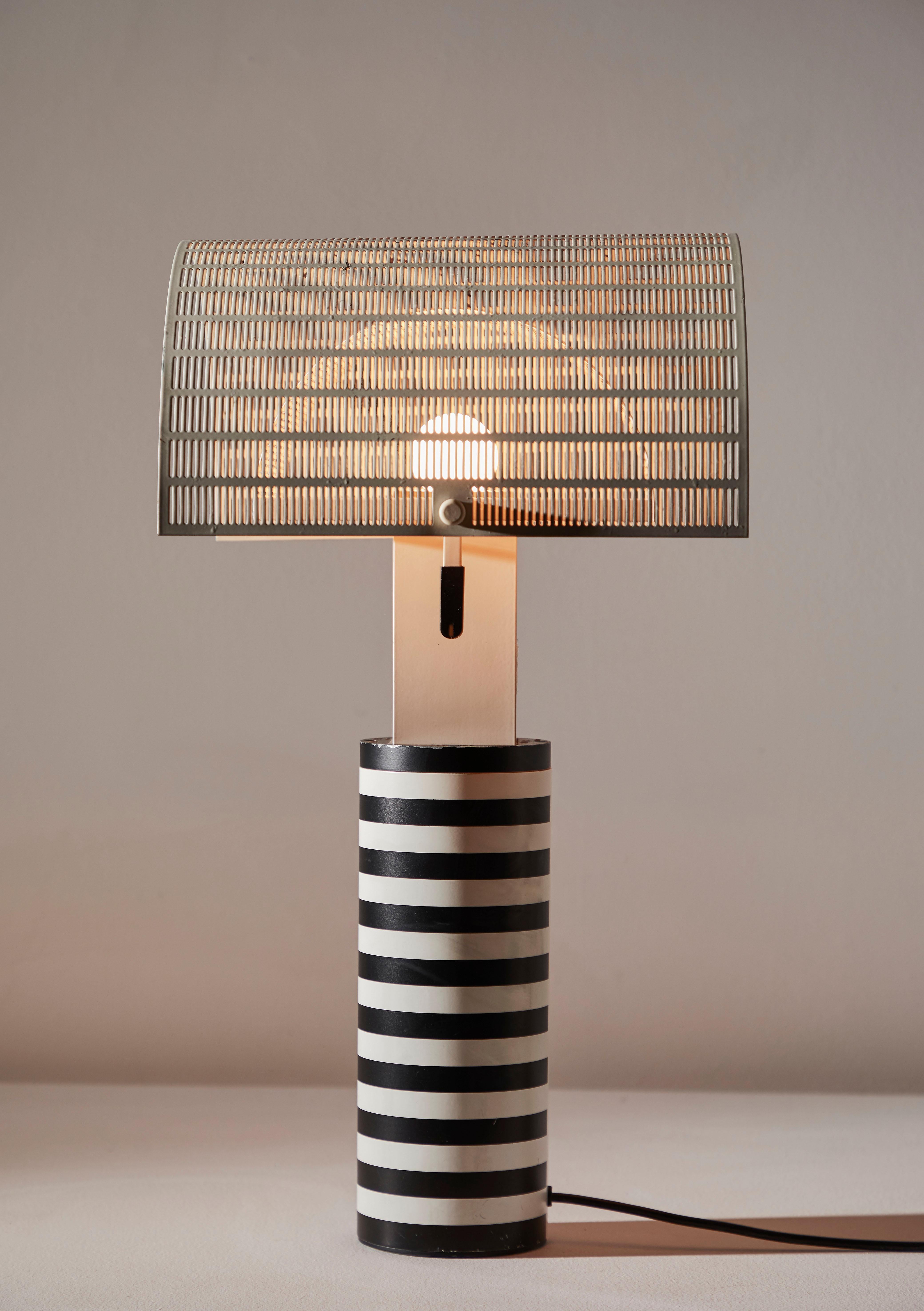 Shogun table lamp designed by Mario Botta for Artemide in Italy, 1986. Enameled aluminum, steel and acrylic. Original cord. Metal diffusers adjust independently. Takes one E27 100w maximum bulb. Bulbs provided as a onetime courtesy.
