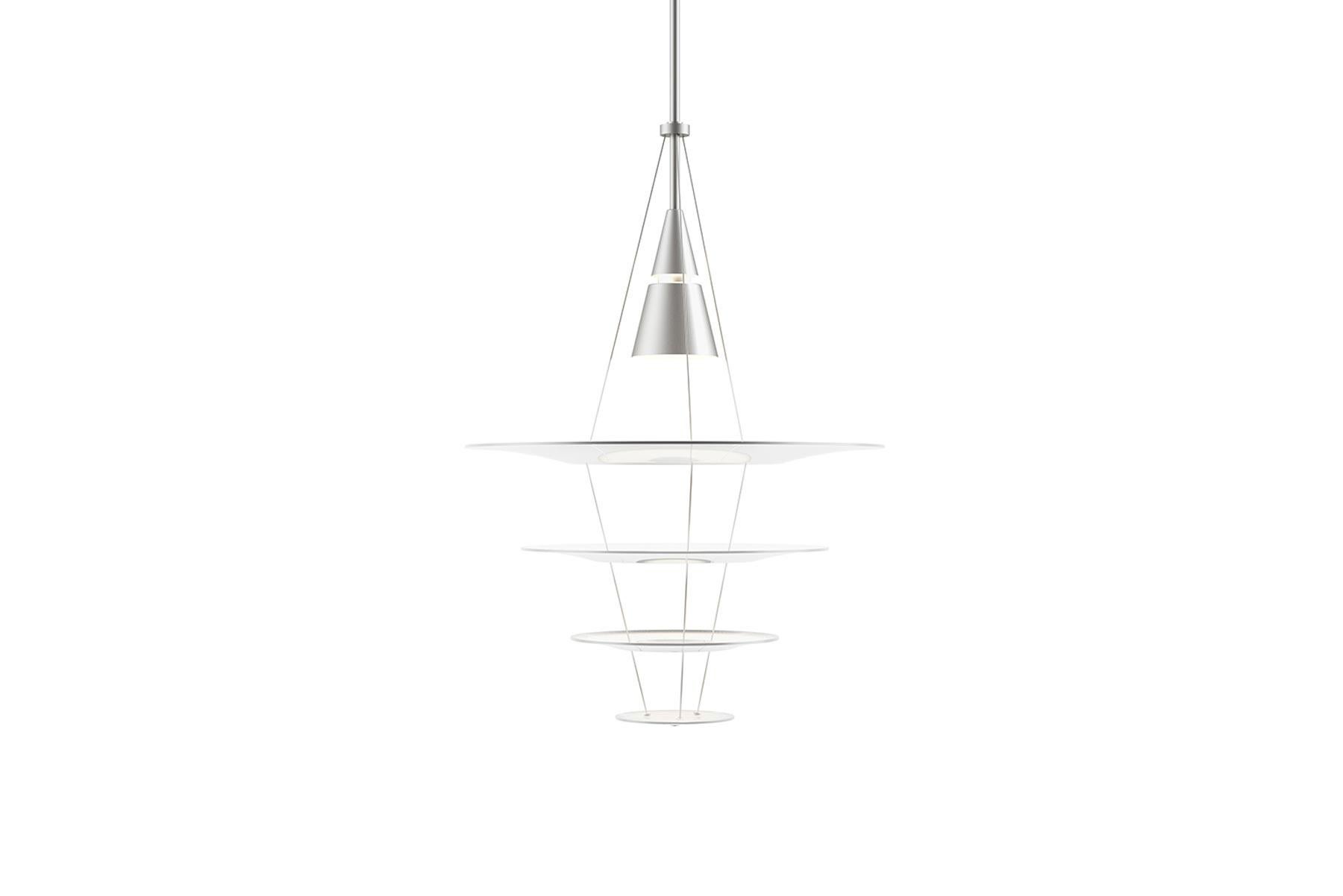 Enigma 425 was designed by Japanese designer Shoichi Uchiyama in 2003. Uchiyama presented a design idea to Louis Poulsen which deconstructed the traditional chandelier concept into slim layers of concentric circles. This involved floating shades