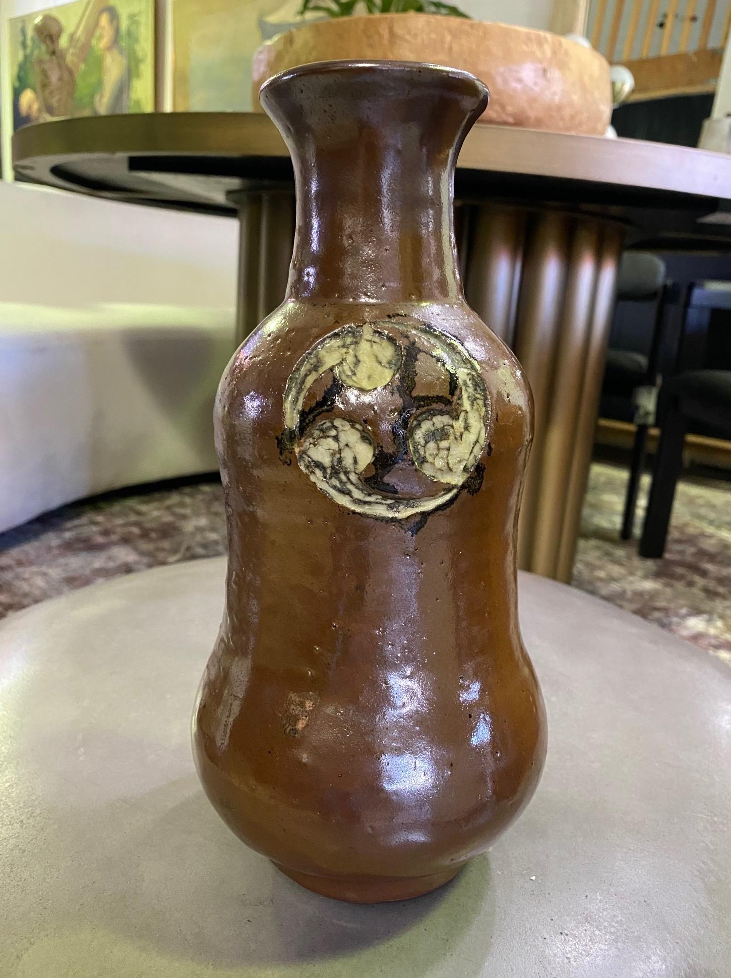 An exquisite, beautifully crafted, and designed gourd vase by master Japanese potter Shoji Hamada, which features a fine example of his famed rich Kaki or persimmon glaze. The original Hamada stamped/sealed and signed box is included. Rare to find