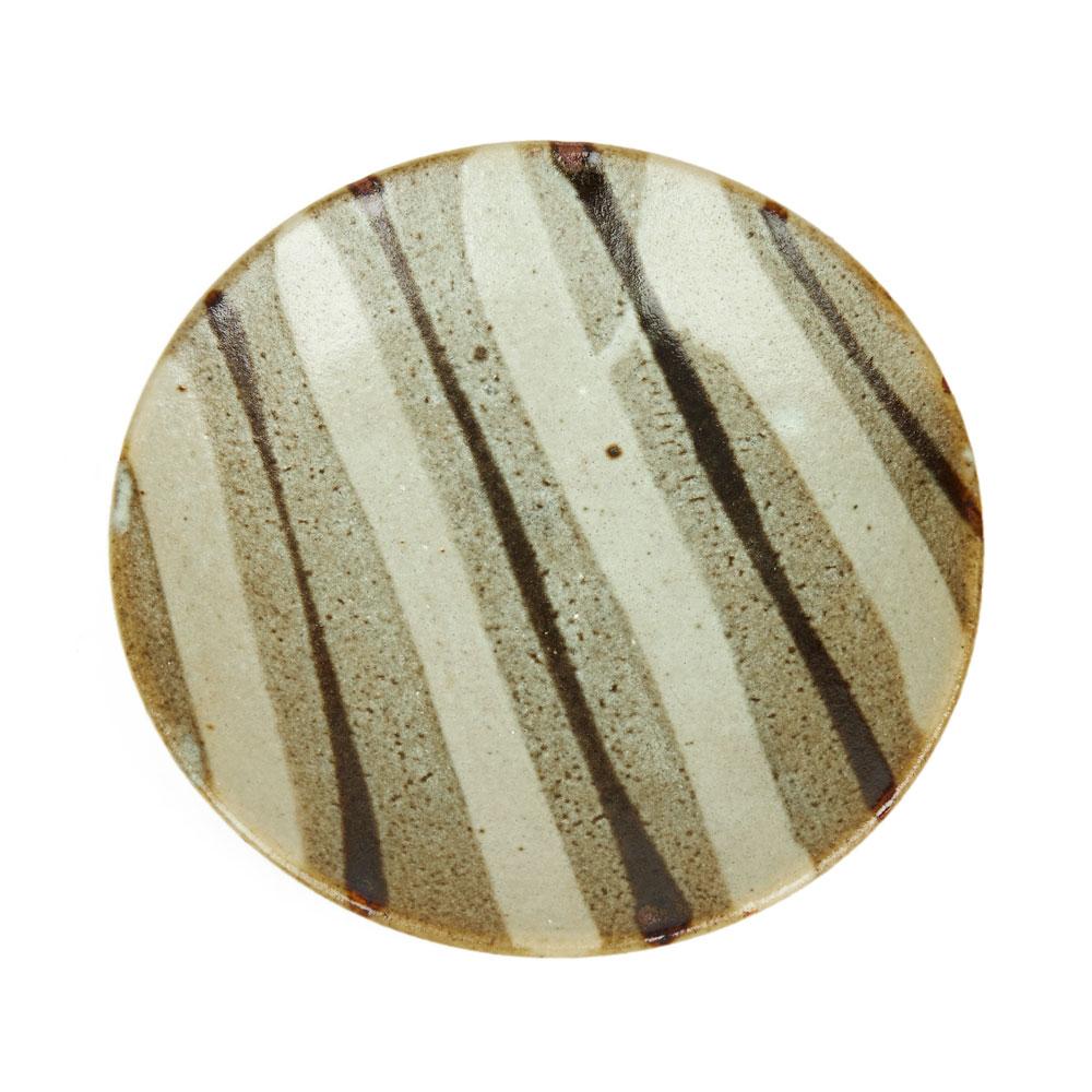 A rare and stunning vintage Shoji Hamada (1894-1978) stoneware studio pottery plate decorated with a stripe design in Nuka glazes with a wonderful lightly textured finish. The plate has all the characteristics of Hamada's work and comes with a
