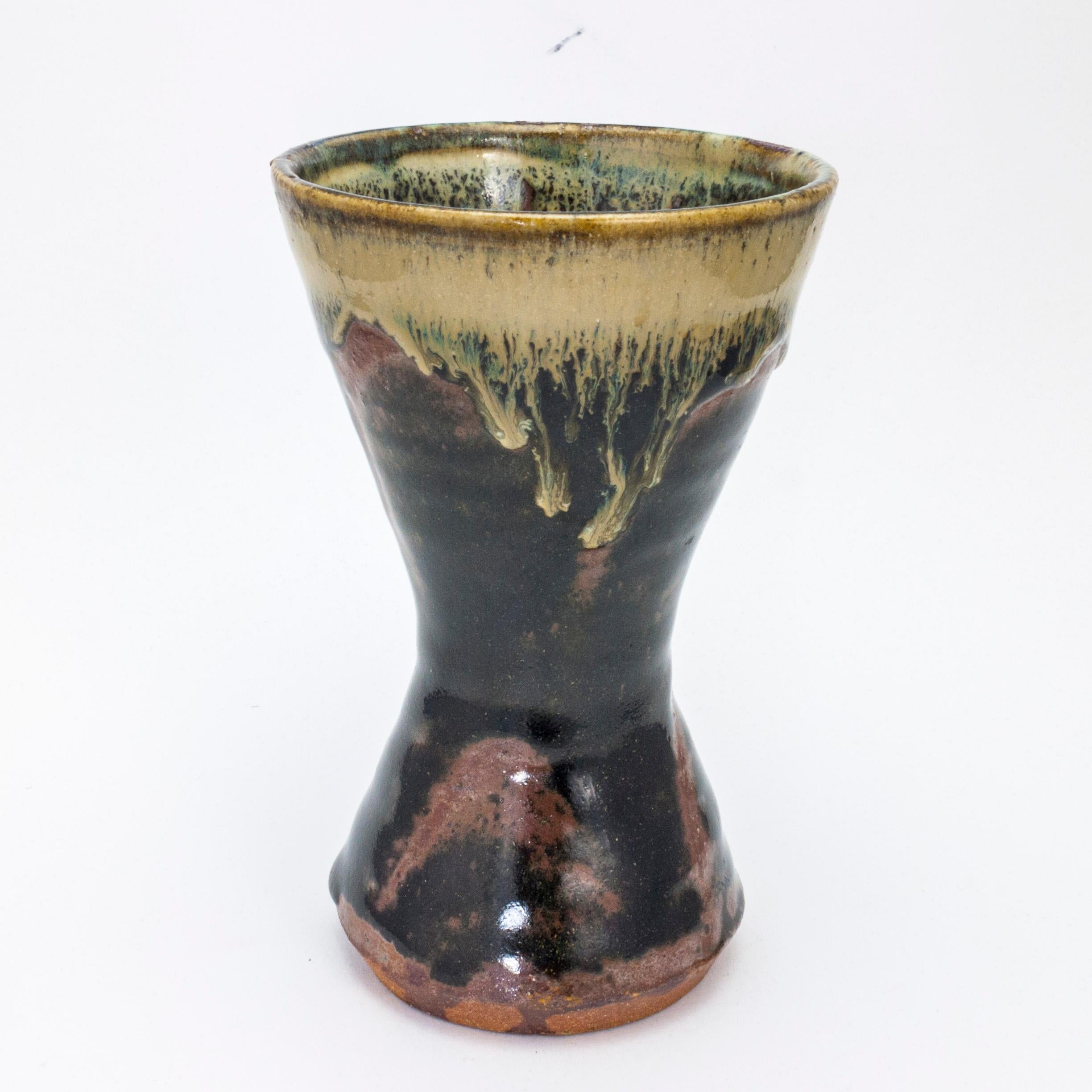 Artist: Shoji Hamada 
Title: Vase
Medium: Stoneware, Kaki Glaze over Transparent Glaze 
Size: 6.5 x 4 x 4inches
Edition: Unique
Provenance: Kansas City Private Collection

Shōji Hamada was a Japanese potter. He was a significant influence on studio