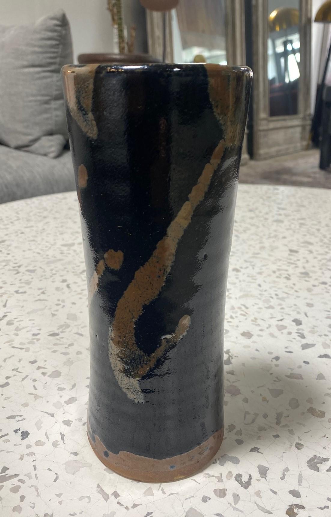 An exquisite, beautifully crafted Japanese pottery vase by master potter Shoji Hamada featuring Hamada's famous signature tenmoku glaze with kaki trailing. The original Hamada signed and sealed wood storage box is included as well as the written