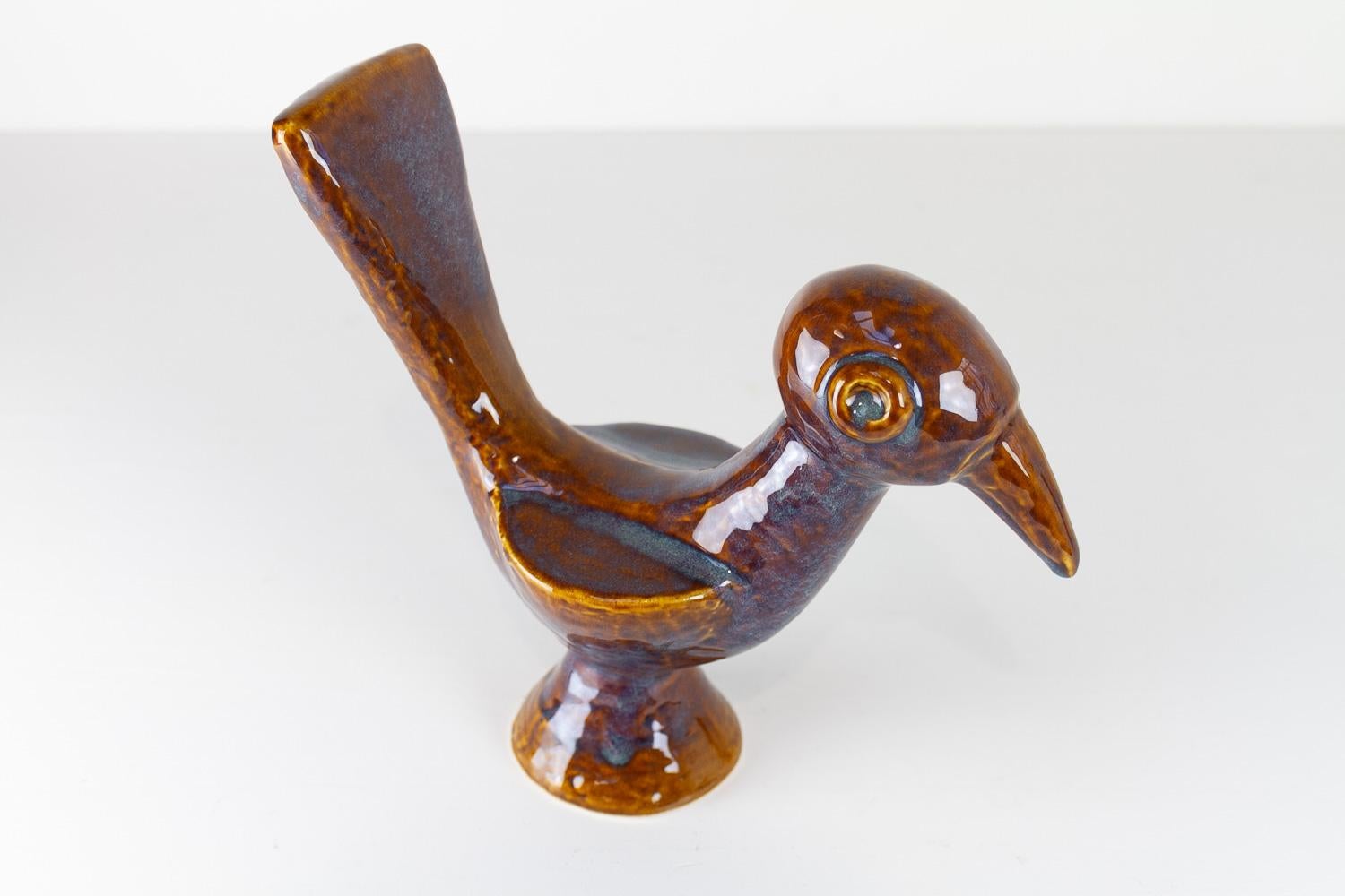 Søholm Ceramic Bird by Gerd Hiorth Petersen, 1960s.

Danish Mid-Century Modern bird figurine in blue and brown glazed ceramic. Created by Gerd Hiorth Petersen for Søholm Denmark. 
Beautiful and adorable naive expression in the classic exquisite