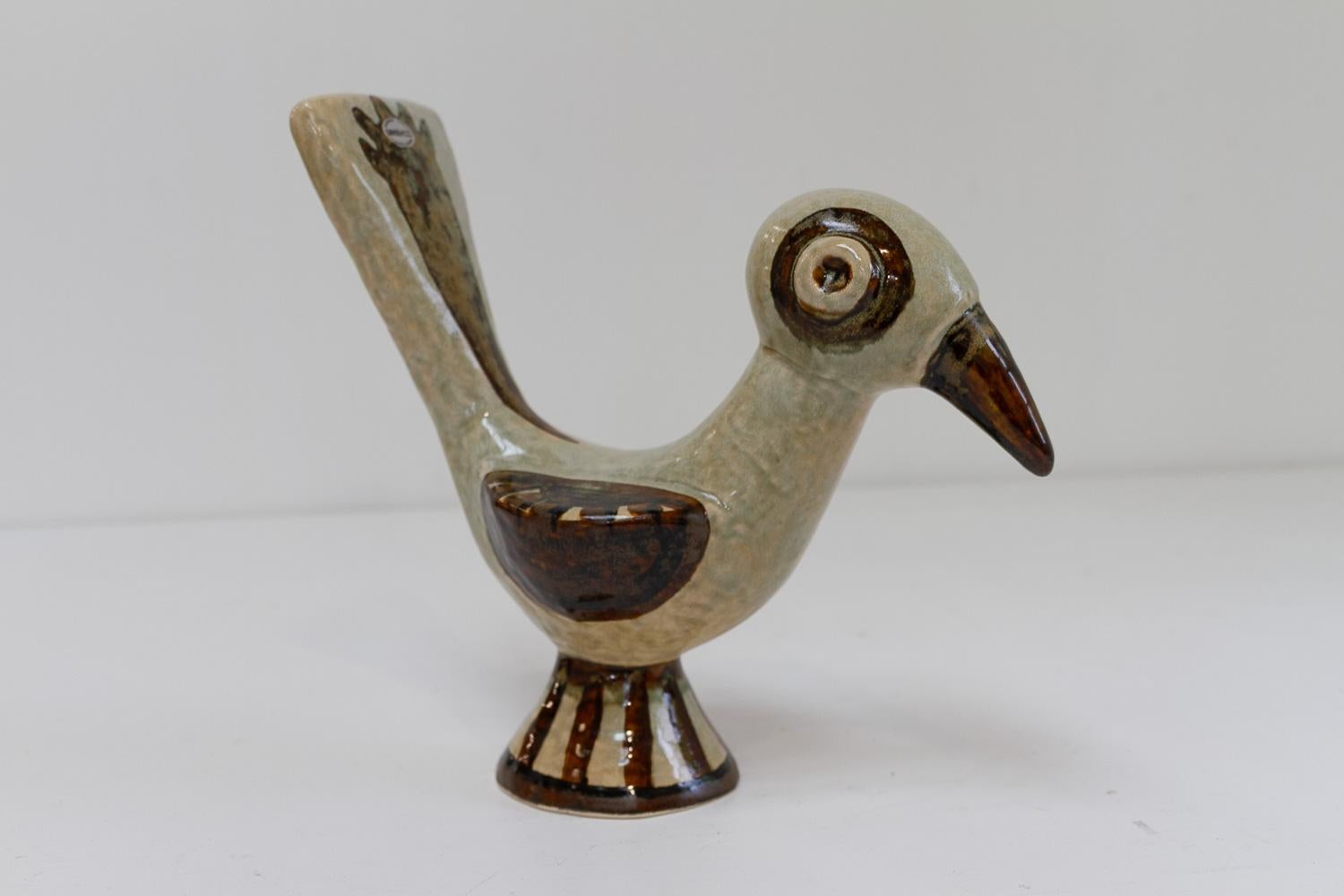 Søholm Ceramic Bird by Gerd Hiorth Petersen, 1960s.

Danish Mid-Century Modern bird figurine in beige and brown glazed ceramic. Created by Gerd Hiorth Petersen for Søholm Denmark. 
Beautiful and adorable naive expression in the classic exquisite