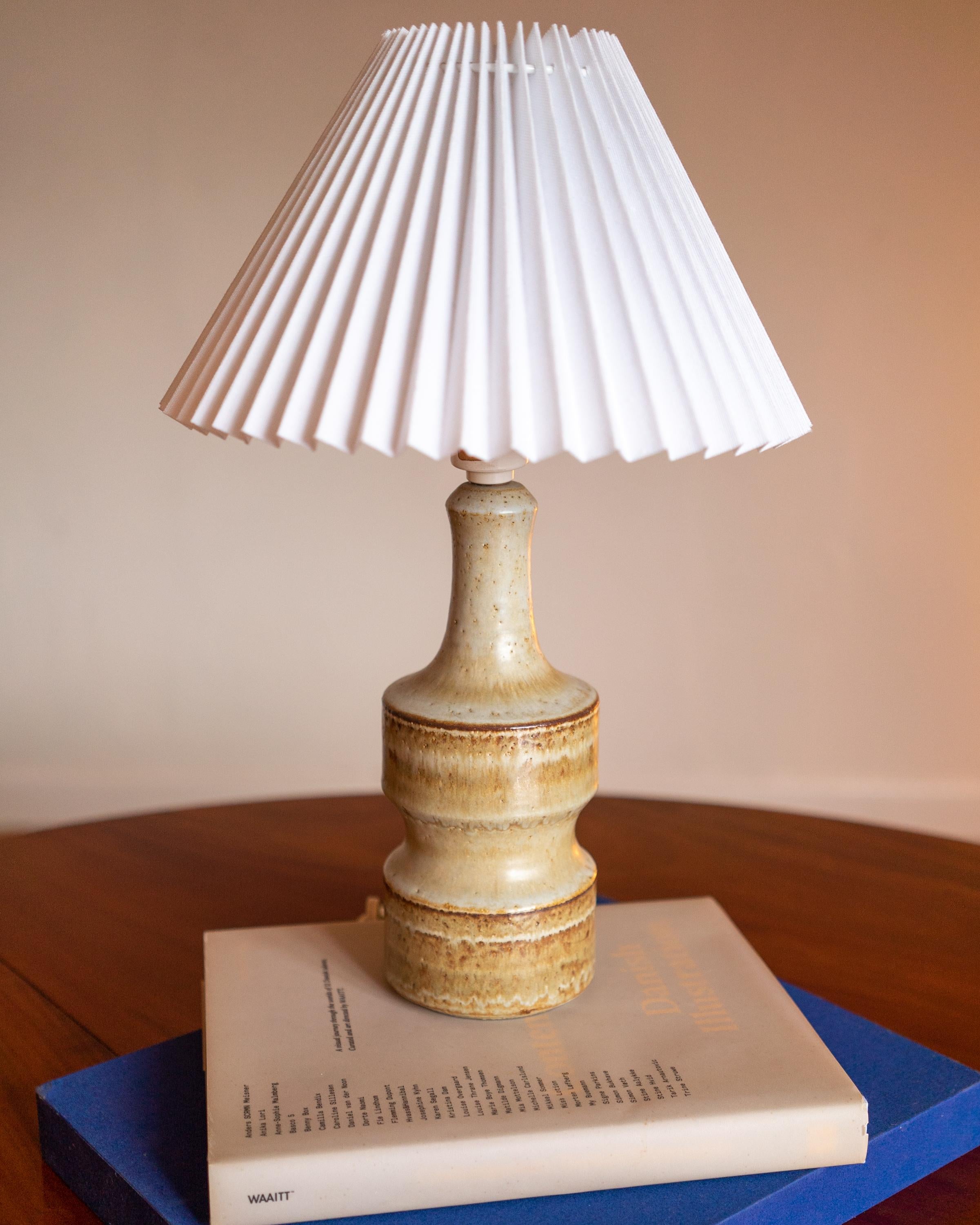 A ceramic table lamp produced by Søholm Keramik, located on the island of Bornholm in Denmark in the 1960s. 

Switch on fitting. Stamped and signed on base.. Fully functional and in good condition.

Sold without lampshade. Stated dimensions