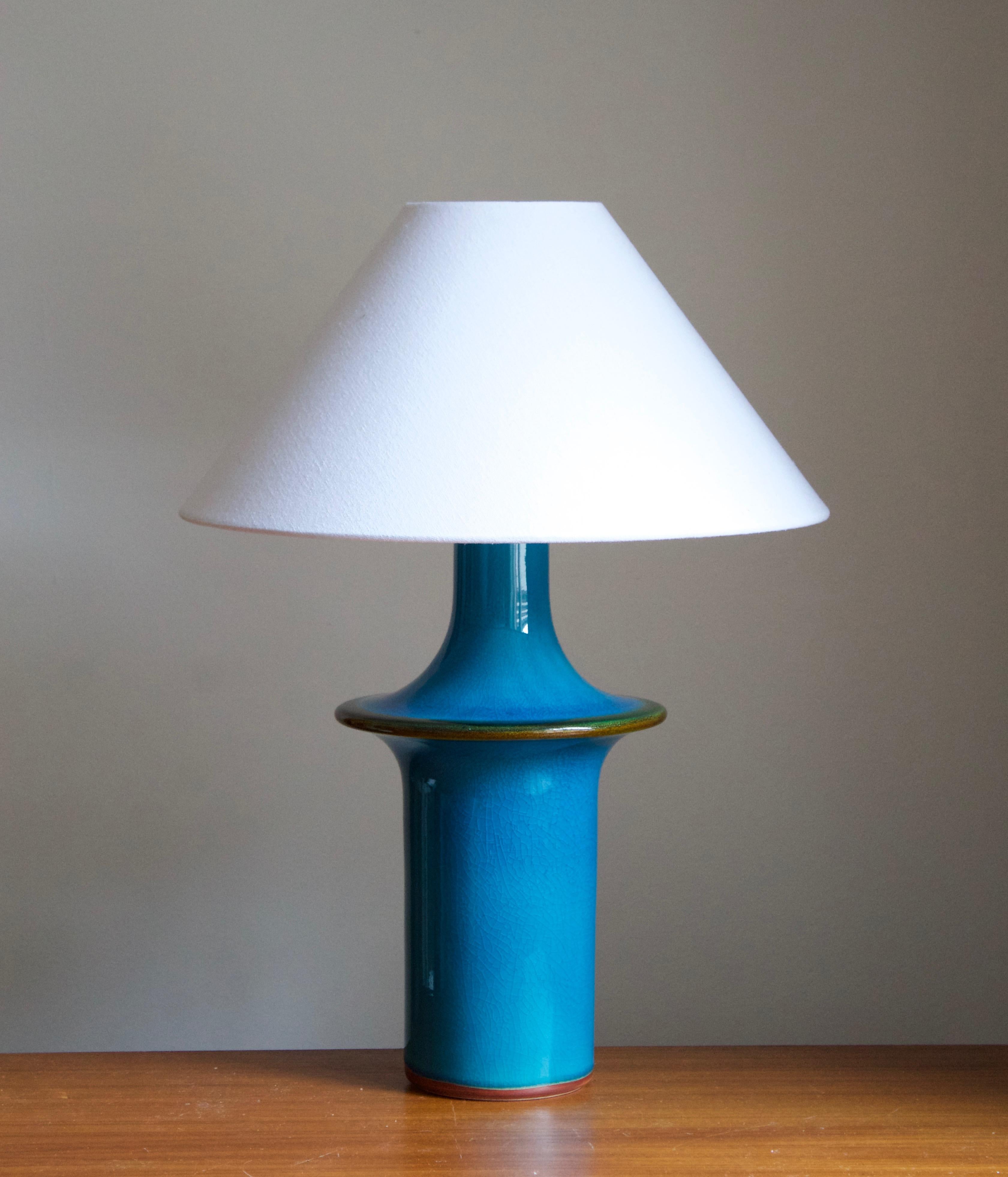 A large table lamp produced by Søholm Keramik, located on the island of Bornholm in Denmark. Features a highly artistic glazed and incised decor. 

Stated dimensions exclude the lampshade. Height includes socket. Sold without lampshade.

Other