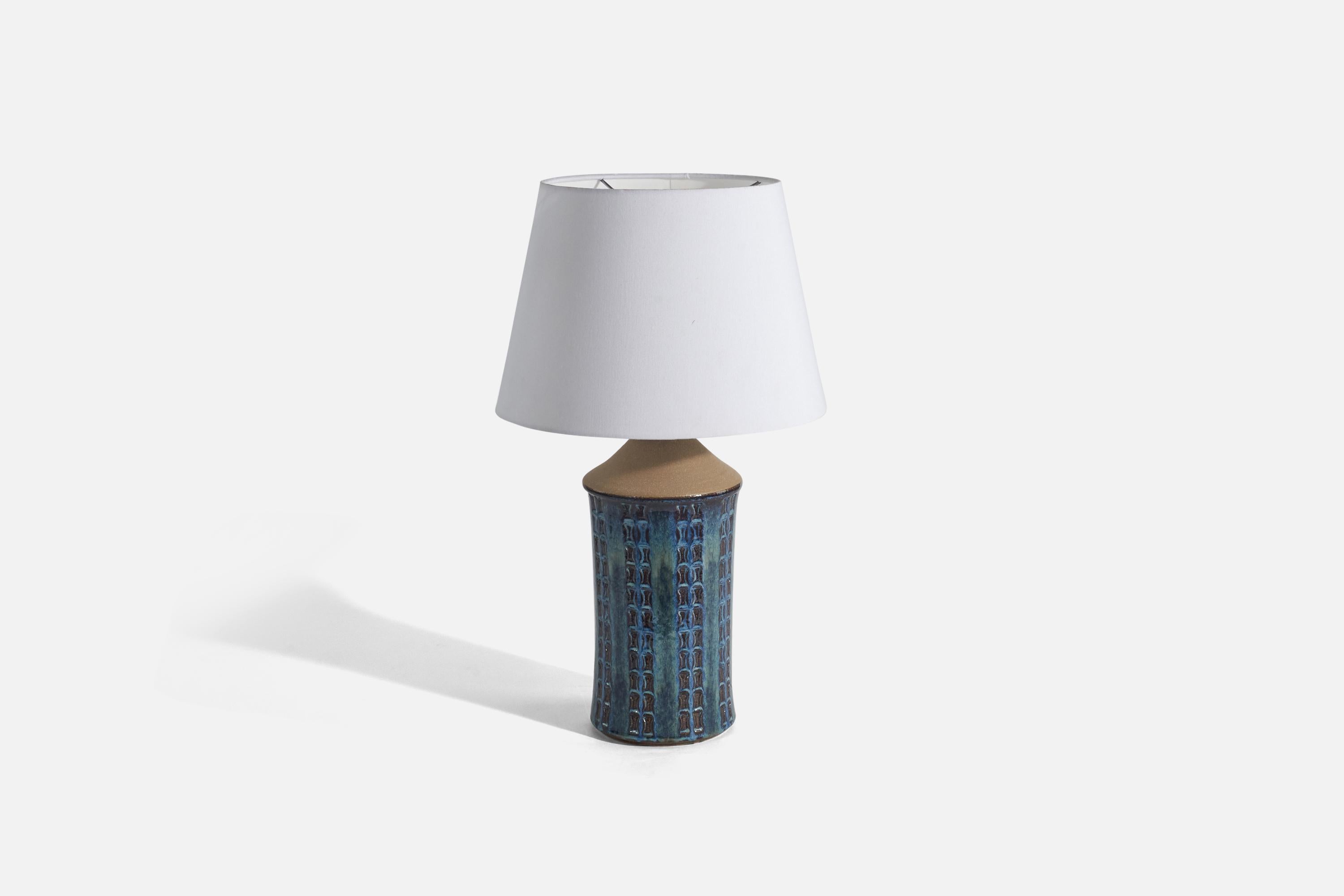 A blue-glazed stoneware table lamp designed and produced by 
Søholm Stentøj, Denmark, 1960s.