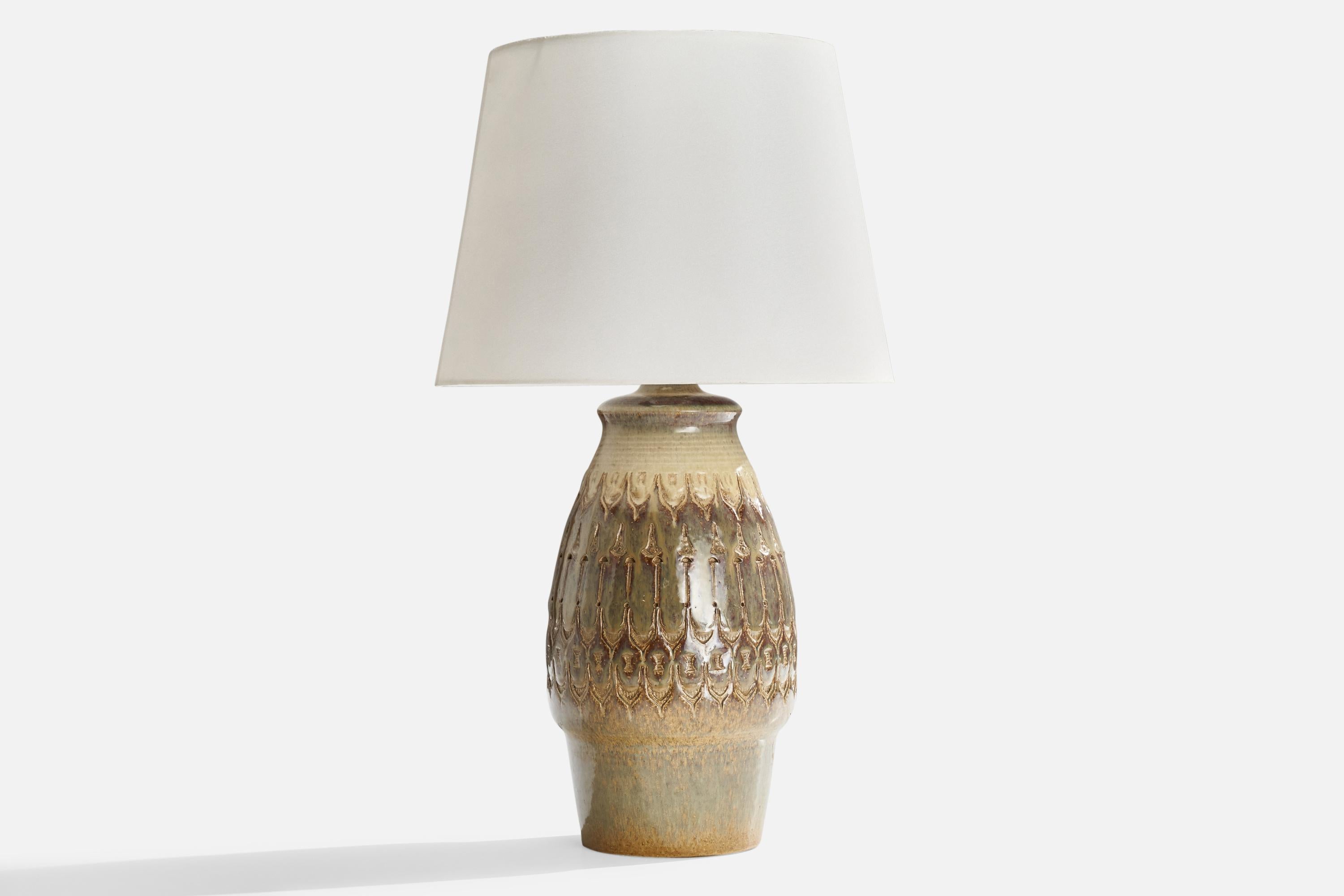 An incised grey-glazed stoneware table lamp produced by Søholm Keramik, Bornholm, Denmark, c. 1960s.

Dimensions of Lamp (inches): 15.5” H x 6.5” Diameter
Dimensions of Shade (inches): 9” Top Diameter x 12” Bottom Diameter x 9” H
Dimensions of Lamp