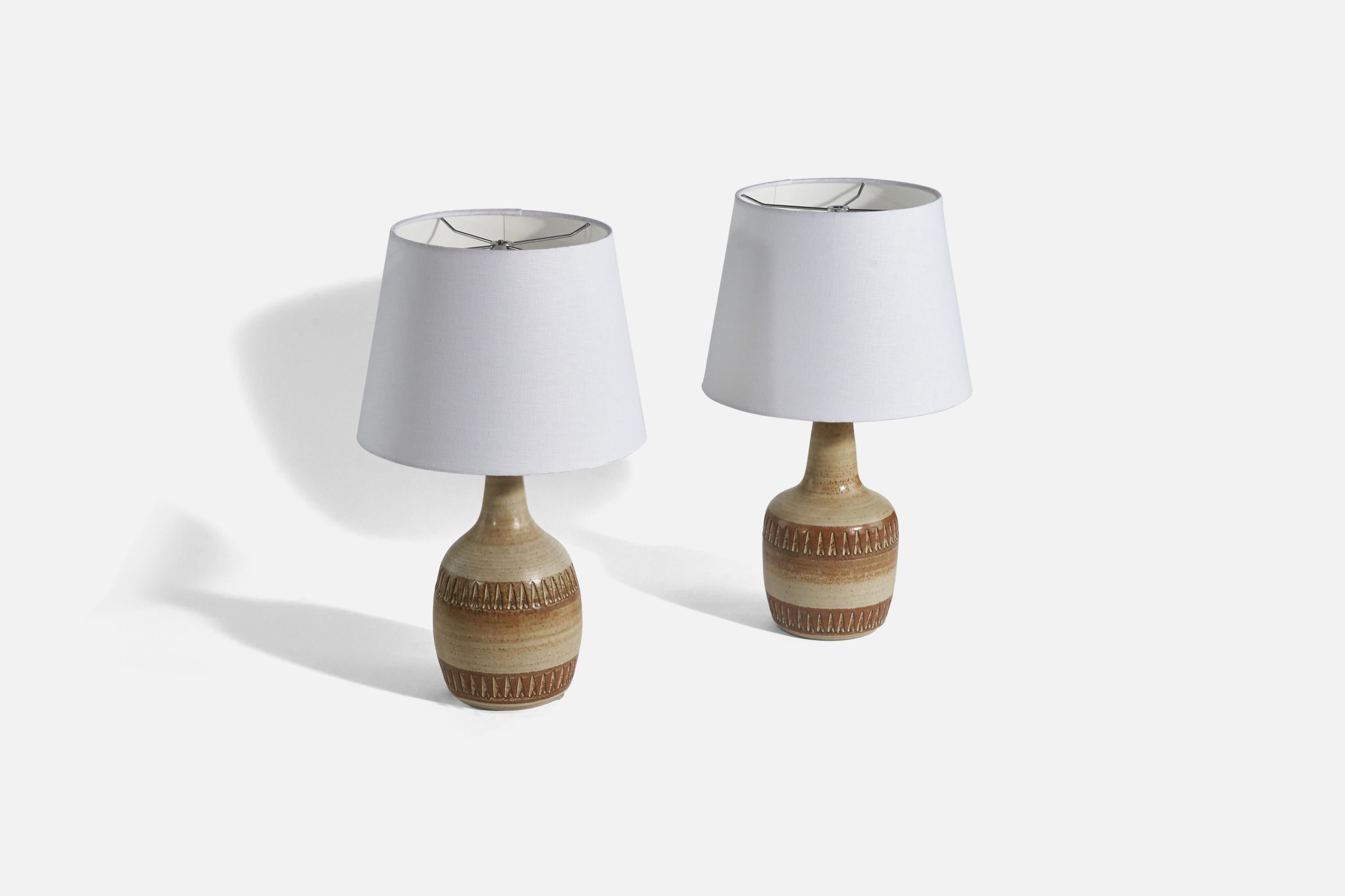 A pair of brown and beige-glazed stoneware table lamps designed and produced by Søholm Stentøj, Denmark, 1960s. 

Sold without Lampshade(s).
Dimensions of Lamp (inches) : 15.31 x 6.37 x 6.37 (Height x Width x Depth)
Dimensions of Shade (inches) : 9