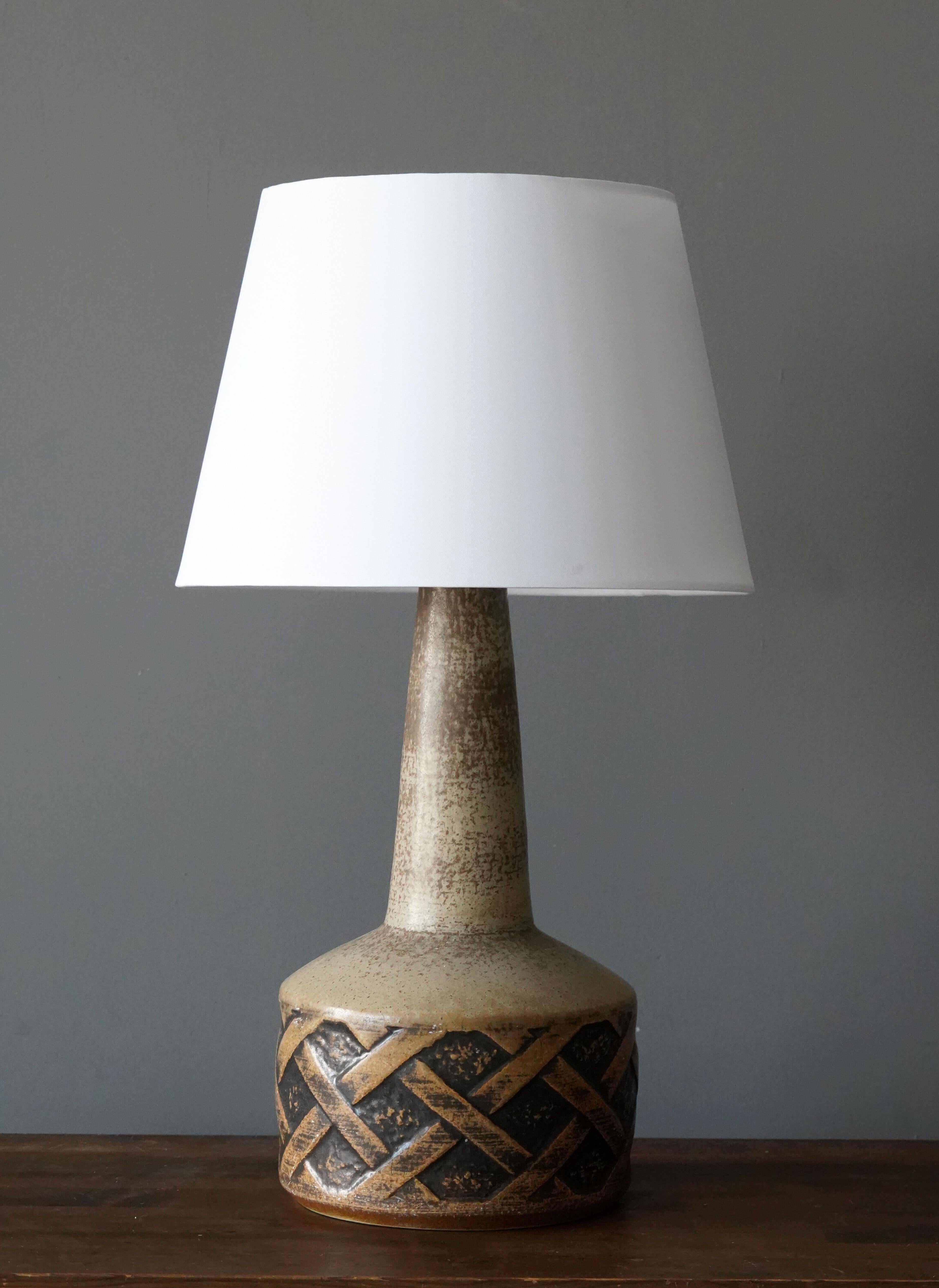 A table lamps produced by Søholm Keramik, located on the island of Bornholm in Denmark. 

Lampshades are attached for reference and are not included in the purchase. Measured without lampshade.

Glaze features brown-beige colors.

Other ceramicists