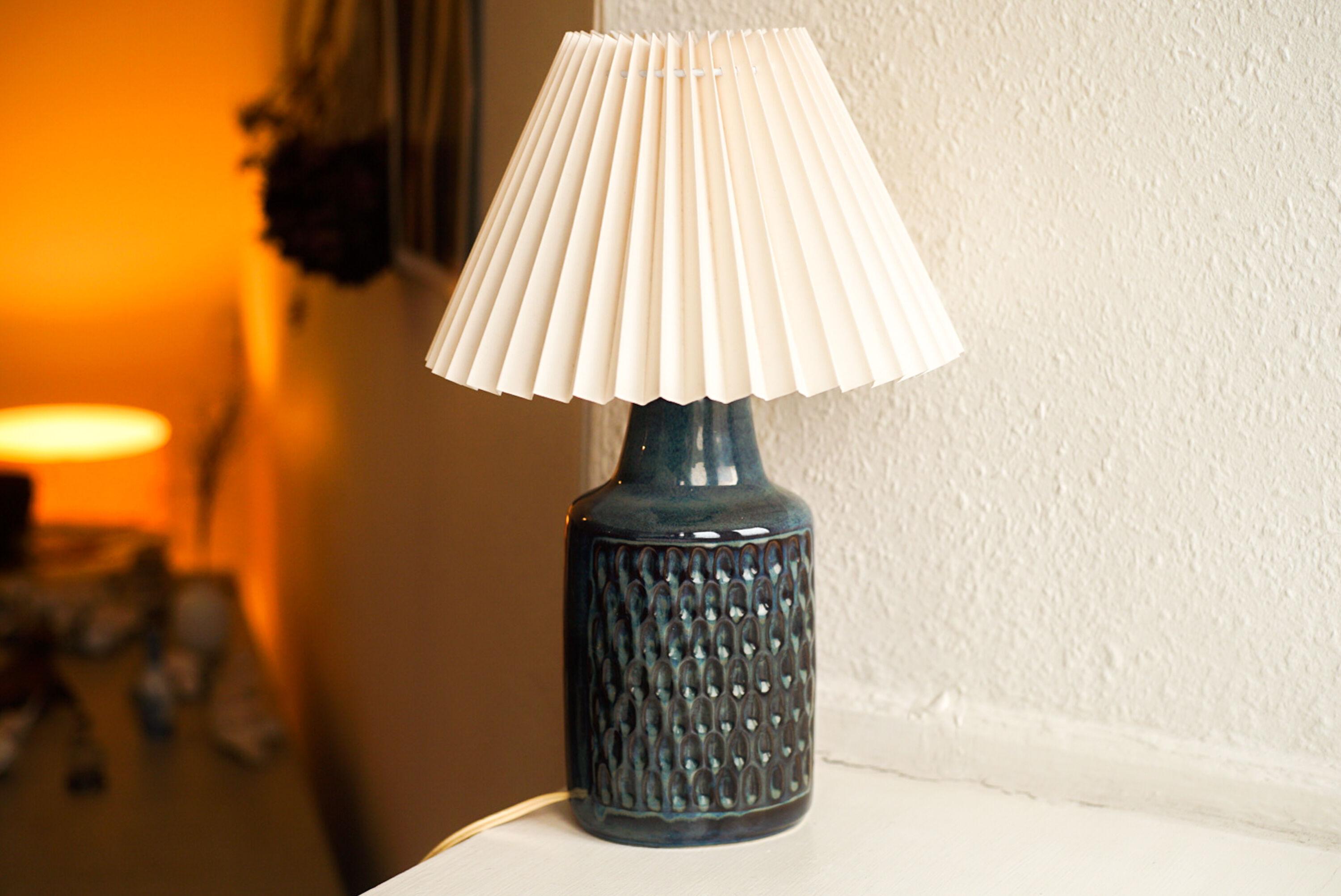 A stoneware table lamp handmade by Einar Johansenf or Søholm located on the island of Bornholm in Denmark in the 1960s.

Stamped and signed on the base.

Sold without lampshade. Height includes socket. fully functional and in beautiful condition.