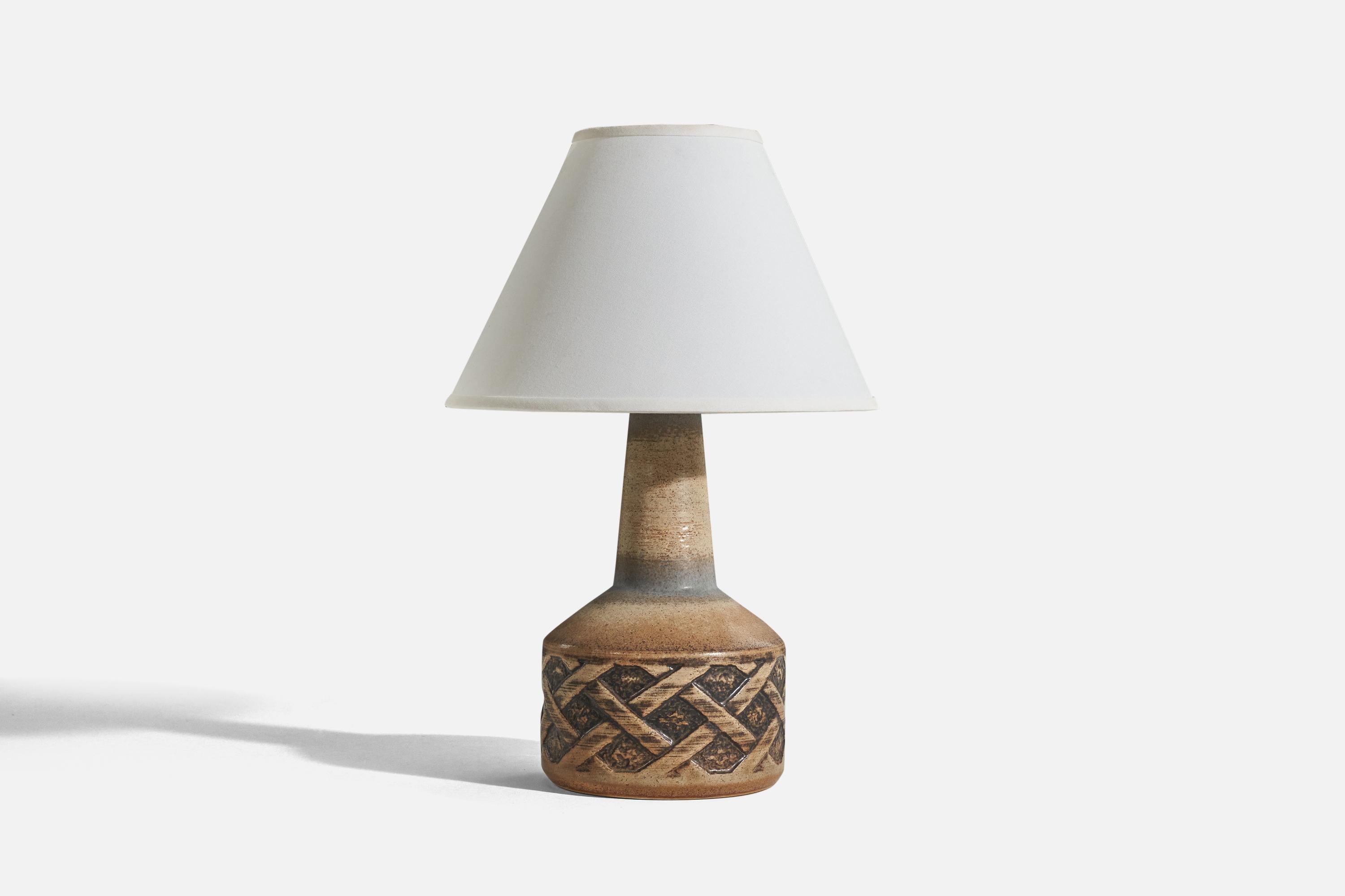 A blue and brown, glazed stoneware table lamp designed and produced by Søholm Stentøj, Denmark, c. 1960s.

Sold without lampshade. 
Dimensions of lamp (inches) : 14.75 x 7.12 x 7.12 (H x W x D)
Dimensions of shade (inches) : 5 x 12.25 x 8.75 (T