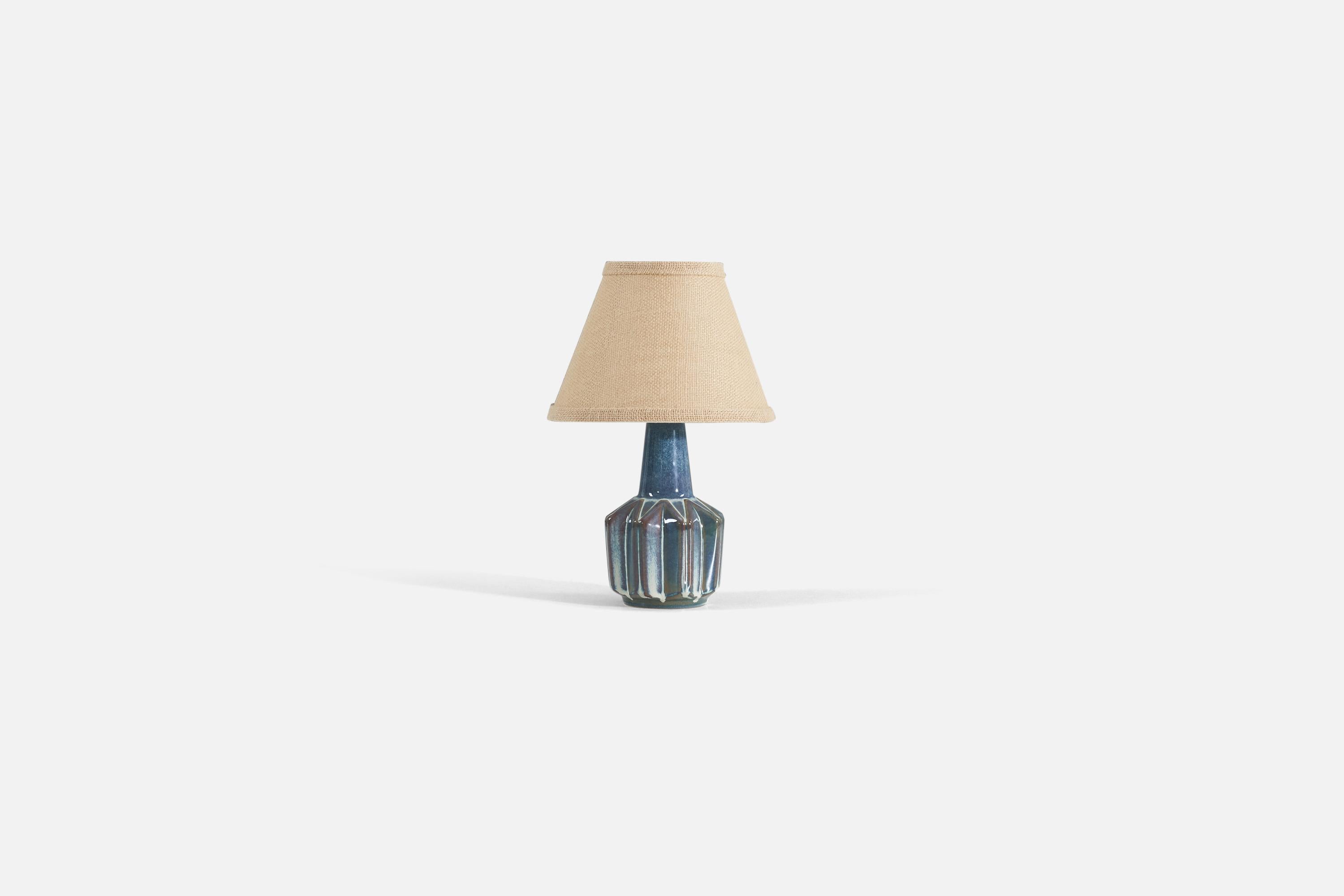 A blue-glazed stoneware table lamp produced by Søholm Stentøj, Denmark, 1960s.

Sold without lampshade. 

Measurements listed are of lamp.
Shade : 4.25 x 8.25 x 6
Lamp with shade : 12.5 x 8.25 x 8.25.