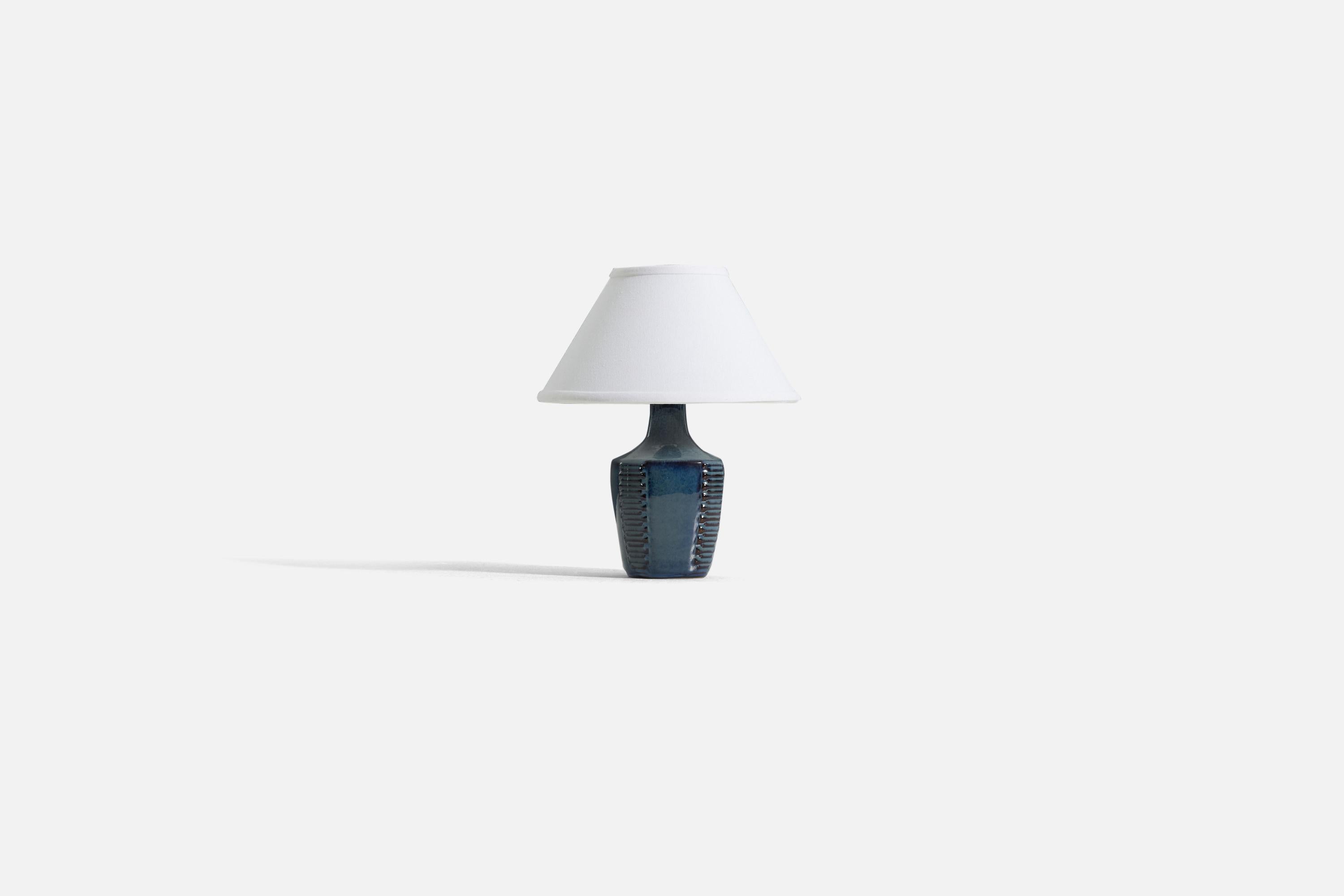 A blue glazed stoneware table lamp, produced by Søholm Stentøj, Denmark, 1960s.

Sold without lampshade. 

Dimensions of Lamp (inches) : 9.5 x 4.25 x 4.5 (H x W x D)
Dimensions Shade (inches) : 4.5 x 10.25 x 6 (T x B x H)
Dimension of Lamp