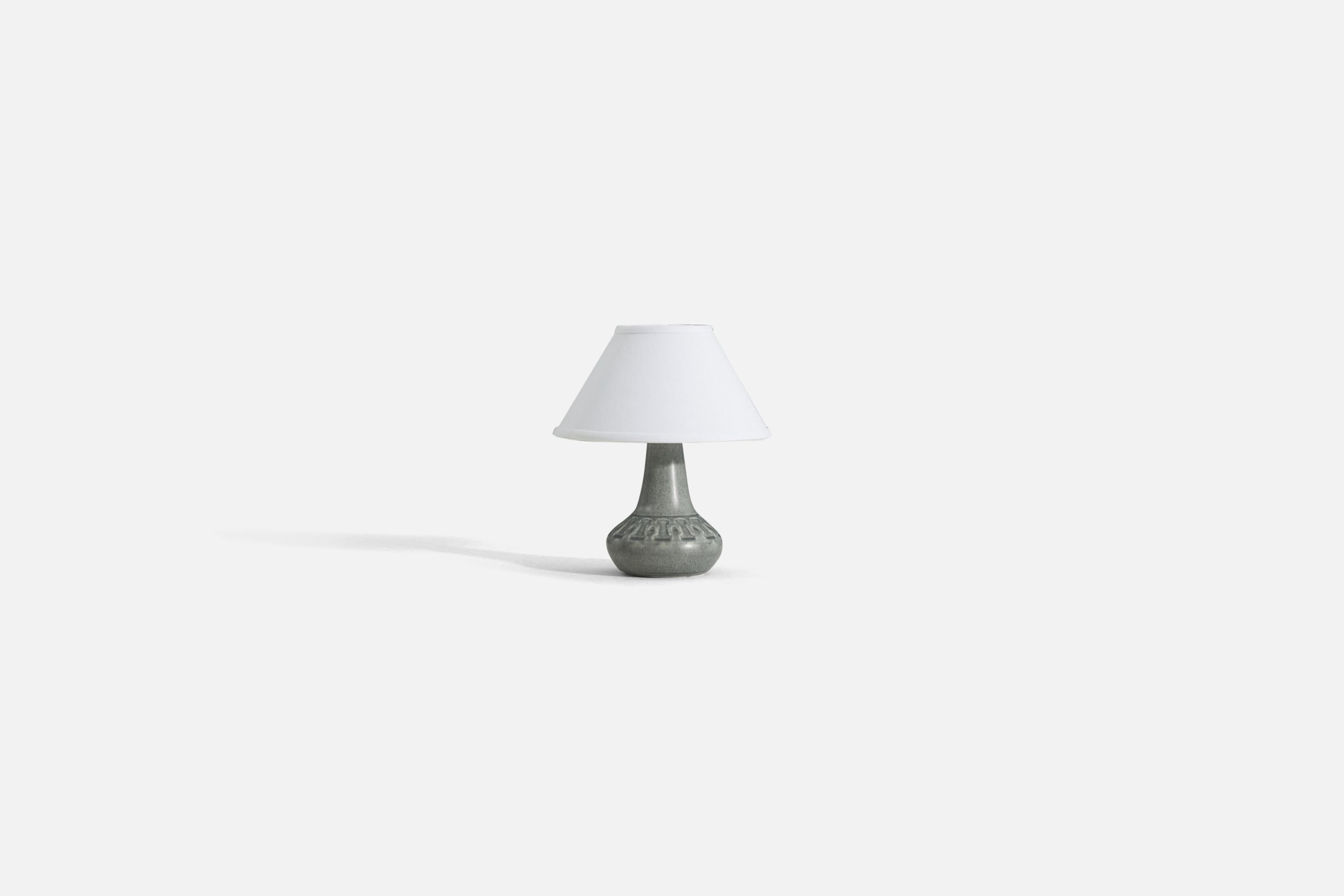 A gray glazed glazed stoneware table lamp, produced by Søholm Stentøj, Bornholm, Denmark, 1960s.

Sold without lampshade. 
Dimensions of Lamp (inches) : 9.5 x 5.5 x 5.5 (H x W x D)
Dimensions Shade (inches) : 4.5 x 10.25 x 6 (T x B x