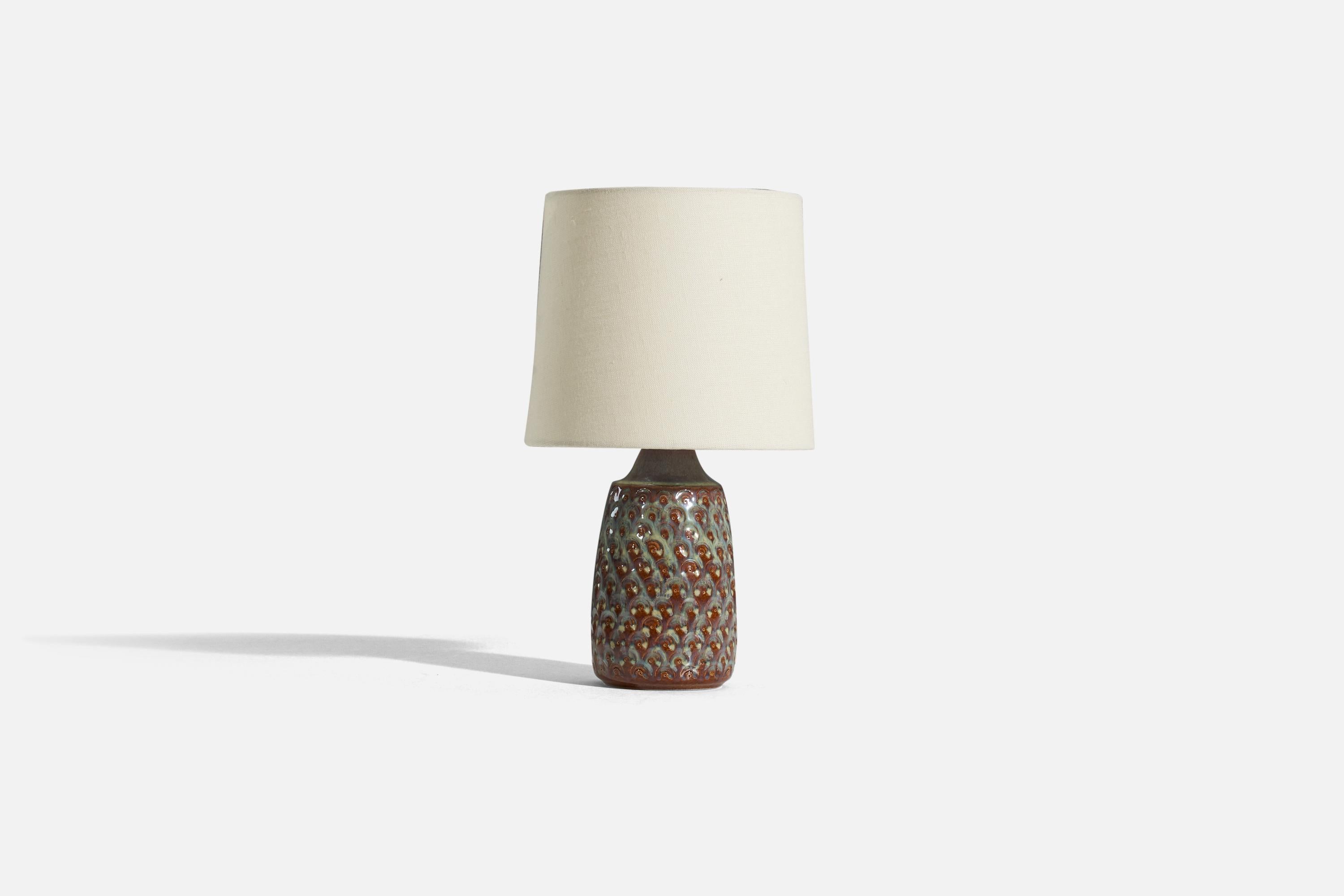 A brown and green, glazed stoneware table lamp designed and produced by Søholm Stentøj, Denmark, 1960s.

Sold without lampshade. 
Dimensions of Lamp (inches) : 9.5625 x 4.0625 x 4.0625 (H x W x D)
Dimensions of Shade (inches) : 7 x 8 x 7 (T x B