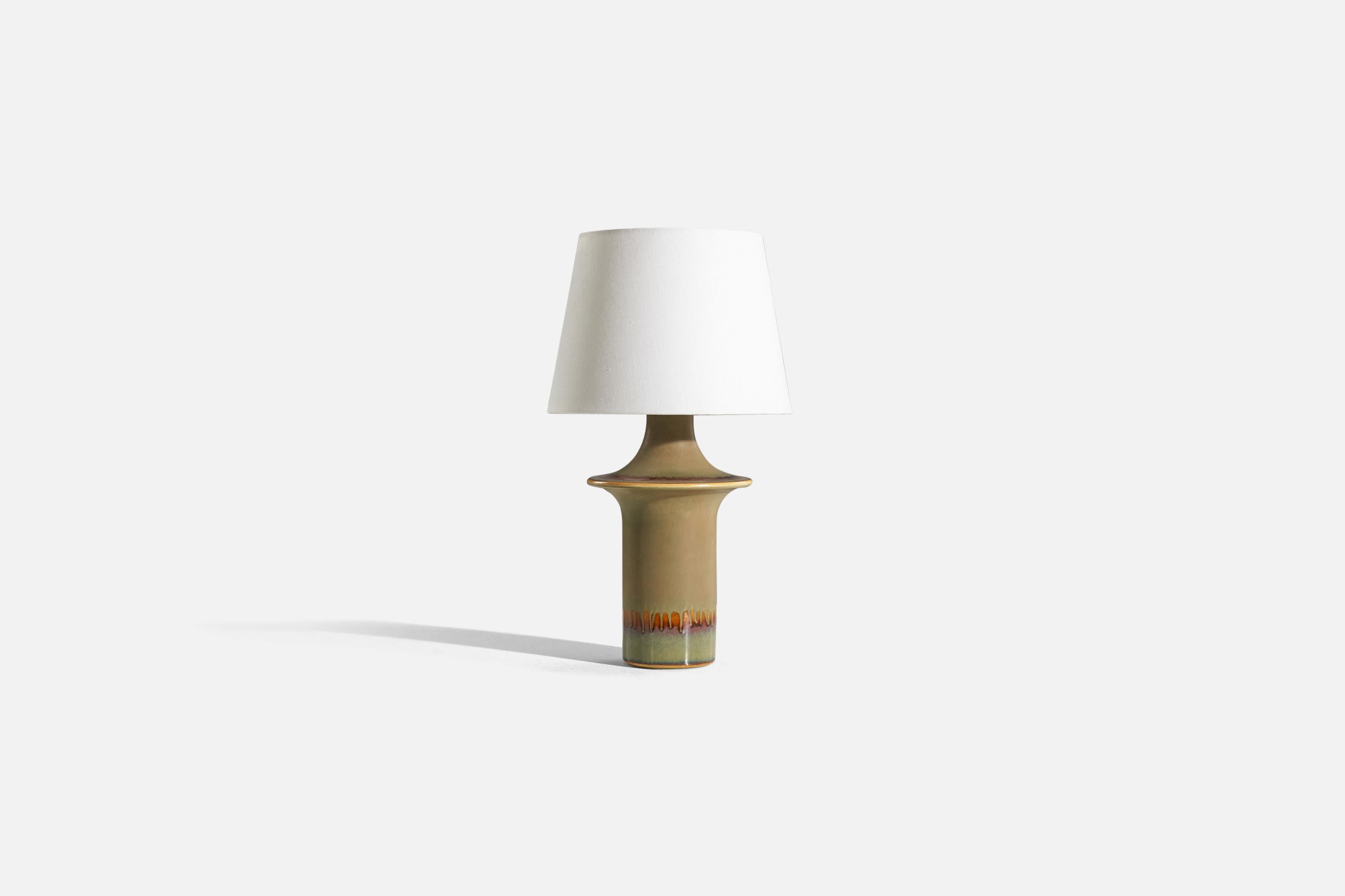 A green and beige, glazed stoneware table lamp designed and produced by Søholm Stentøj, Denmark, 1960s.

Sold without lampshade. 
Dimensions of Lamp (inches) : 17.25 x 8.125 x 8.125 (H x W x D)
Dimensions of Shade (inches) : 9 x 12.125 x 8.875 (T x