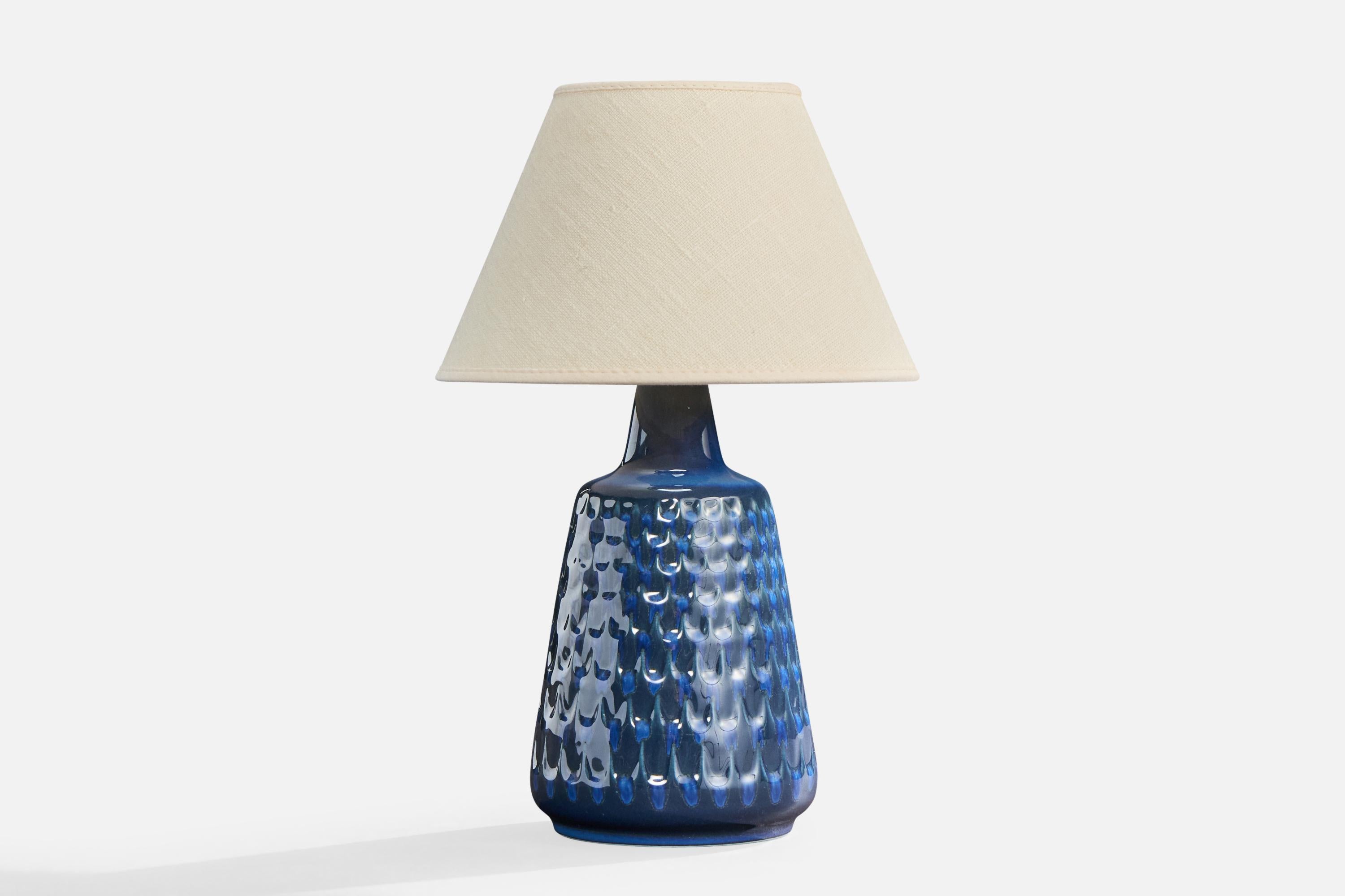 A blue-glazed stoneware table lamp produced by Søholm Stentøj, Bornholm, Denmark, c. 1960s.

Overall Dimensions (inches): 9.625