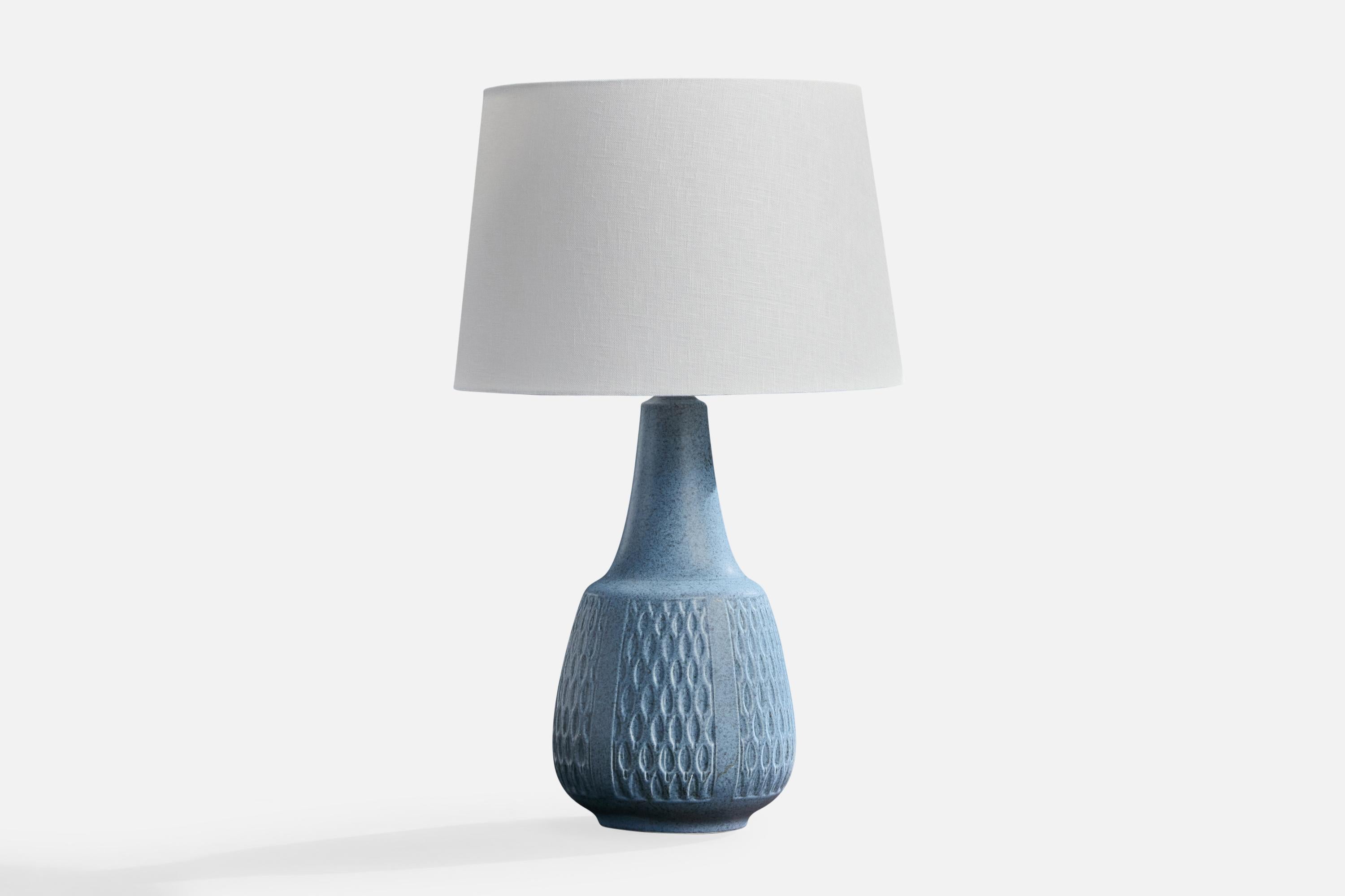 A blue-glazed incised stoneware table lamp produced by Søholm Stentøj, Denmark, c. 1960s.

Dimensions of Lamp (inches): 14.375