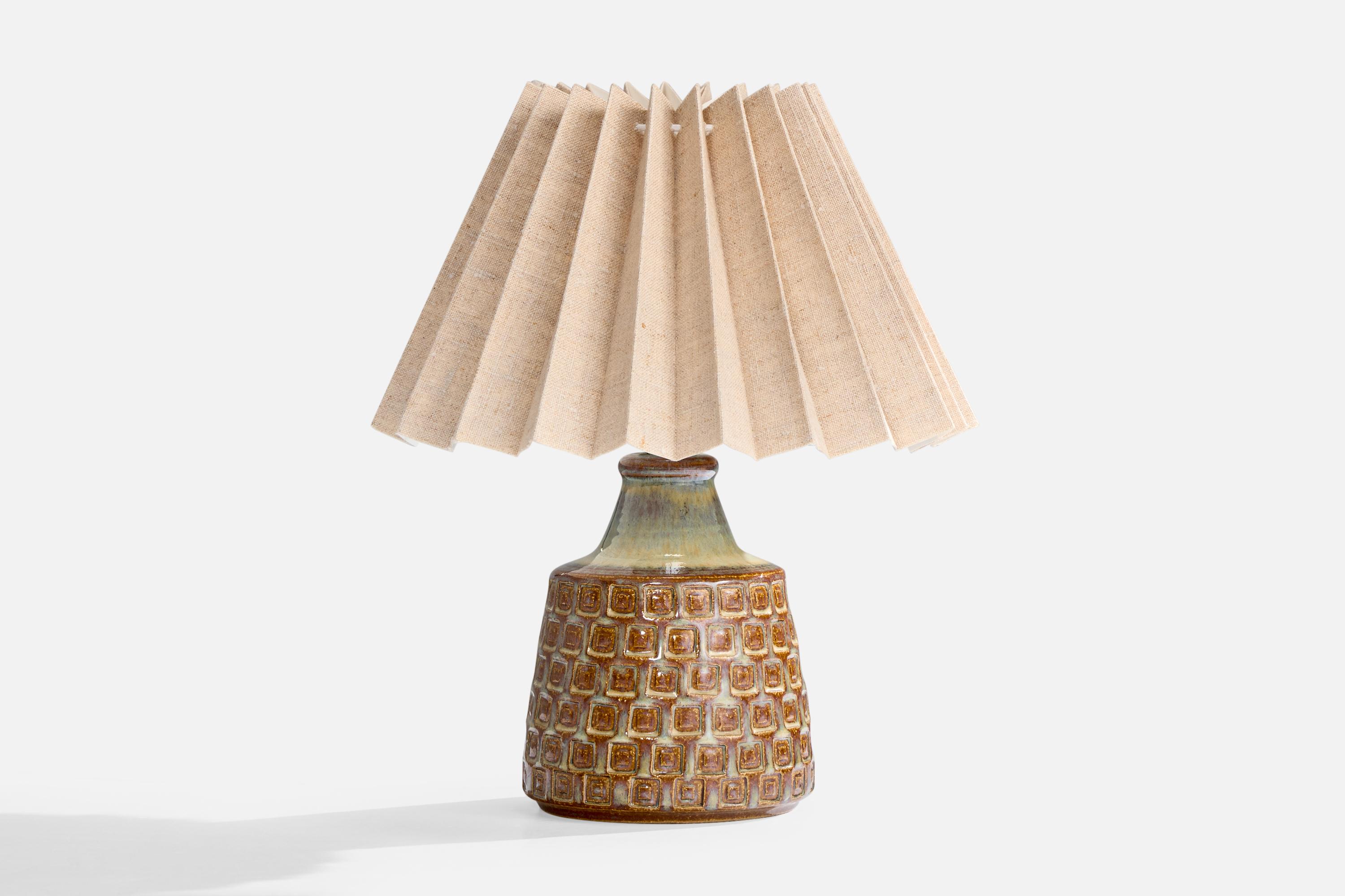 A glazed brown green stoneware and beige fabric table lamp produced by Søholm Stentøj, Denmark, c. 1960s.

Dimensions of Lamp with Shade (inches): 8.0