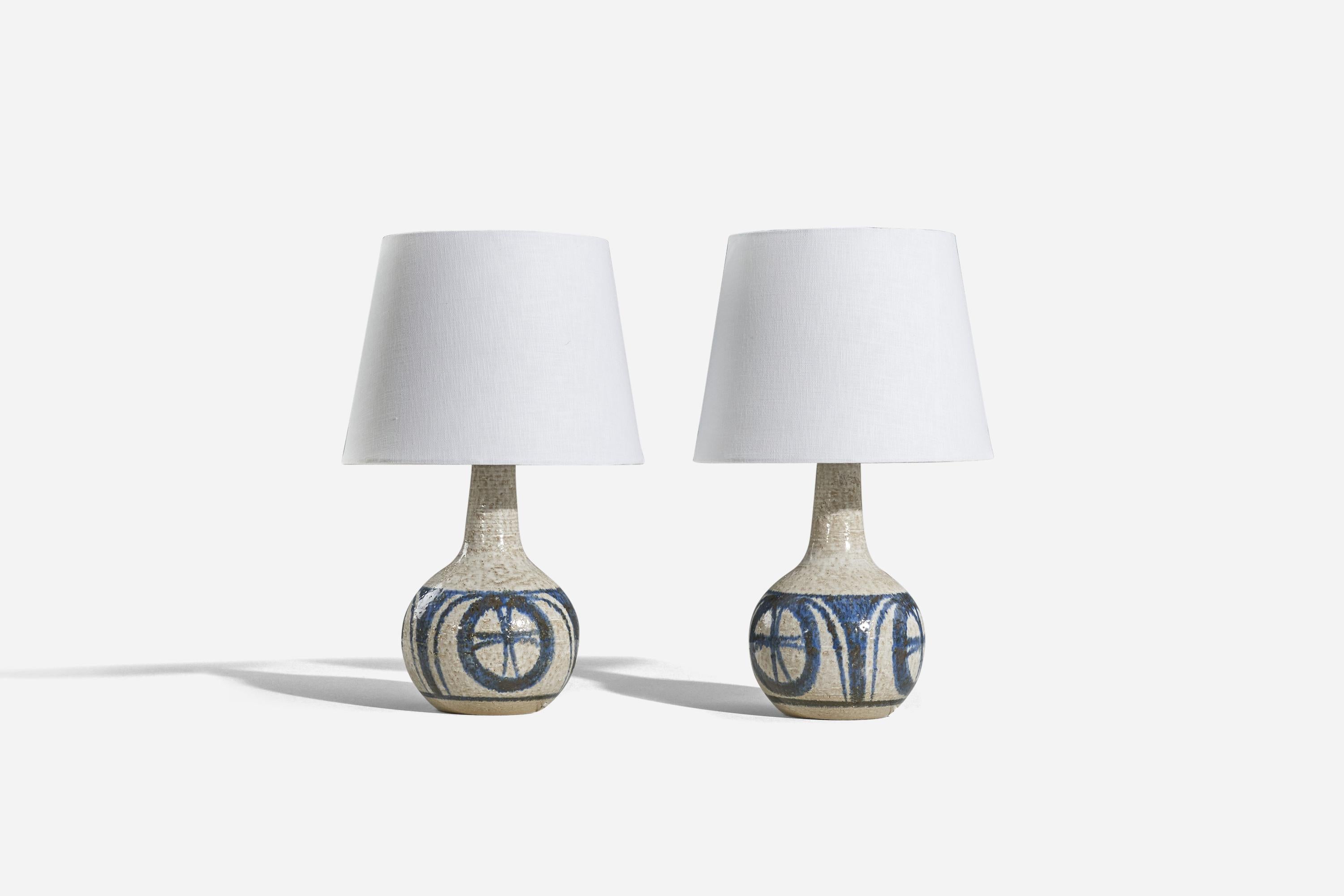 A pair of blue and gray, glazed stoneware table lamp designed and produced by Søholm Stentøj, Bornholm, Denmark, 1960s. 

Sold without lampshade. 
Dimensions of Lamp (inches) : 13.25 x 7.06 x 7.06 (H x W x D)
Dimensions of Shade (inches) : 9 x