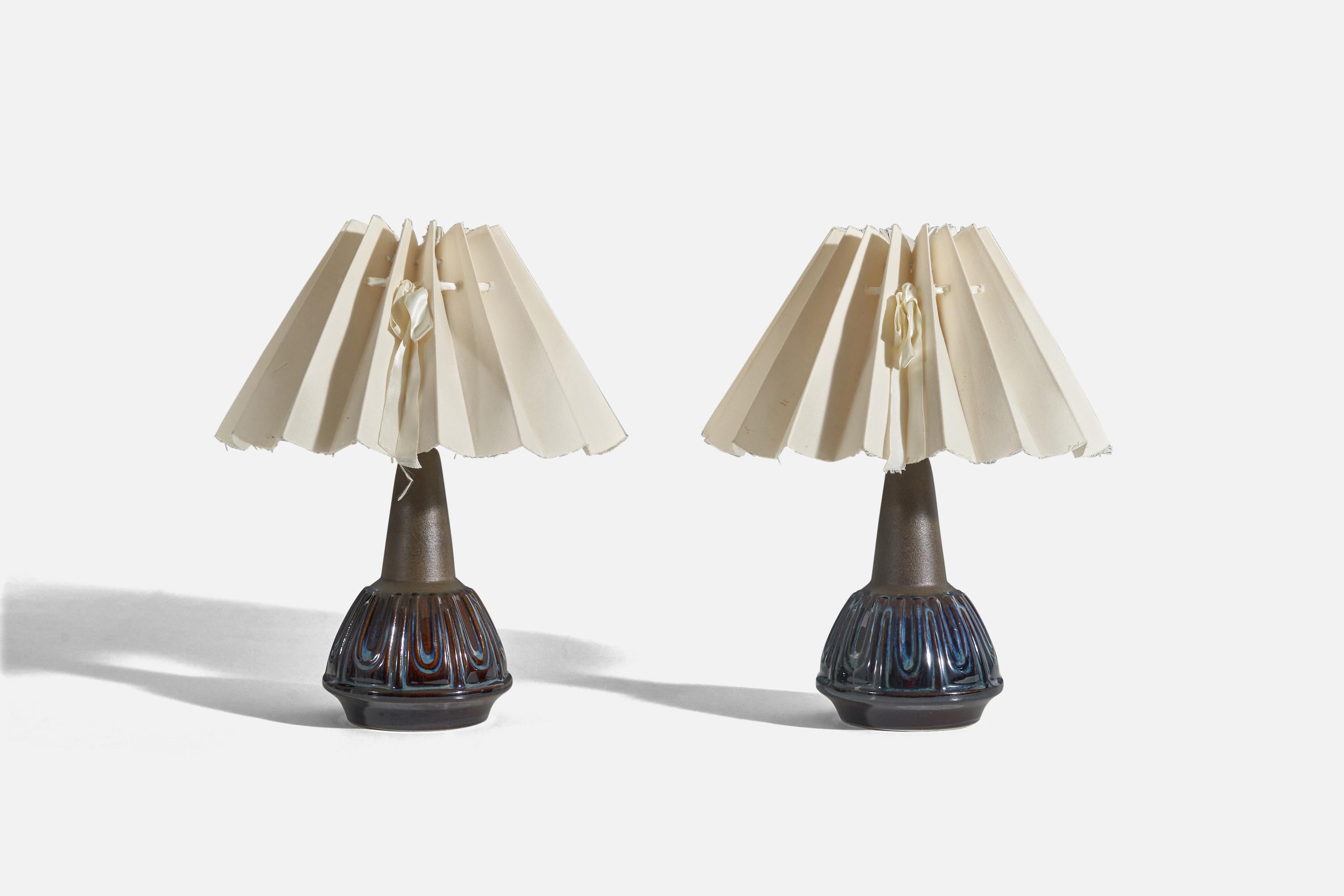 A pair of blue and brown, glazed stoneware and fabric table lamps designed and produced by Søholm Stentøj, Bornholm, Denmark, 1960s. 

Sold with lampshades. 
Dimensions of lamp (inches) : 8.87 x 4.51 x 4.51 (Height x Width x Depth)
Dimensions of