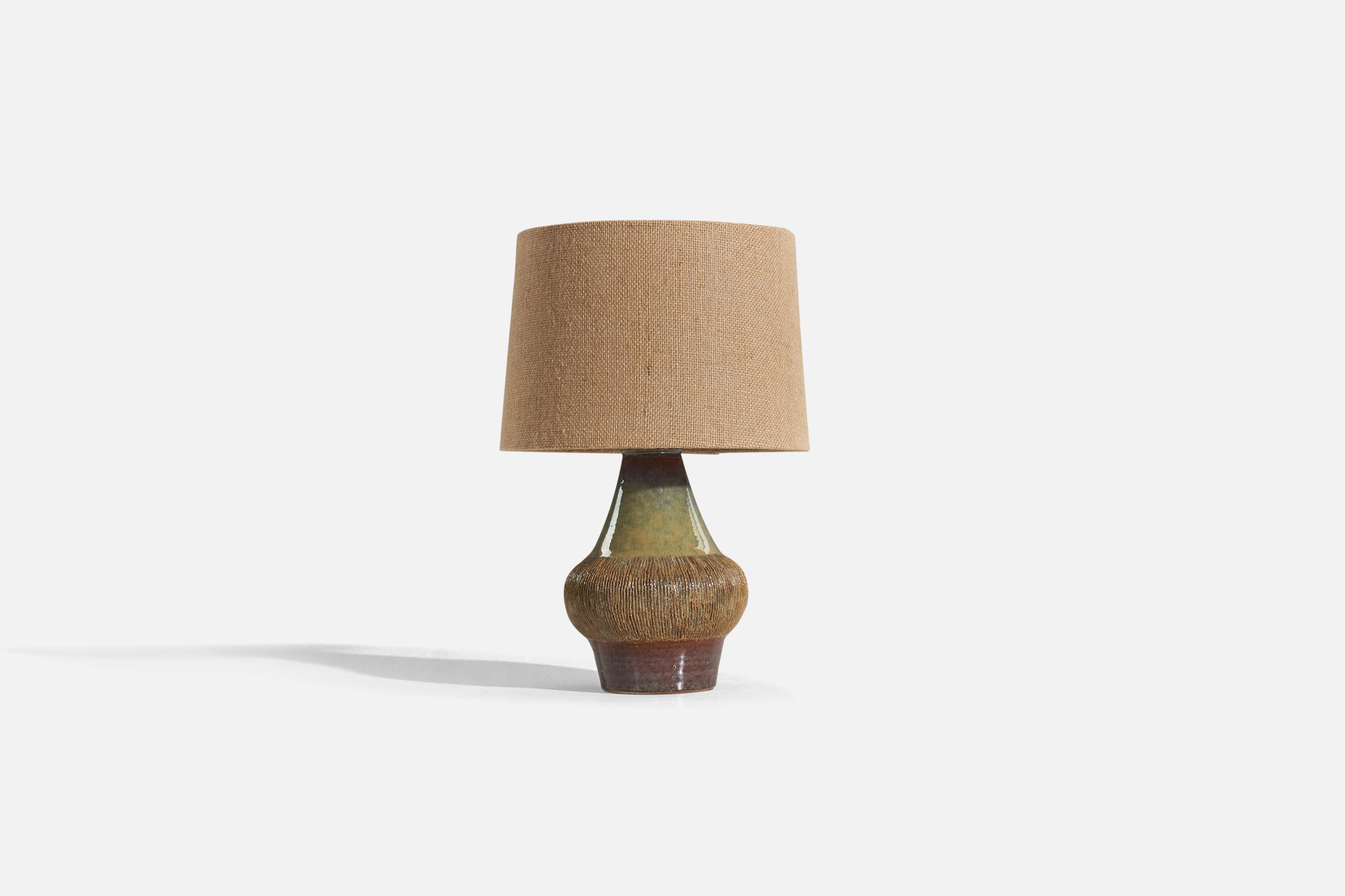 A green and brown, glazed stoneware table lamp designed and produced by Søholm Stentøj, Bornholm, Denmark, 1960s. 

Sold without lampshade. 
Dimensions of Lamp (inches) : 11.125 x 6.625 x 6.625 (H x W x D)
Dimensions of Shade (inches) : 7.1875 x
