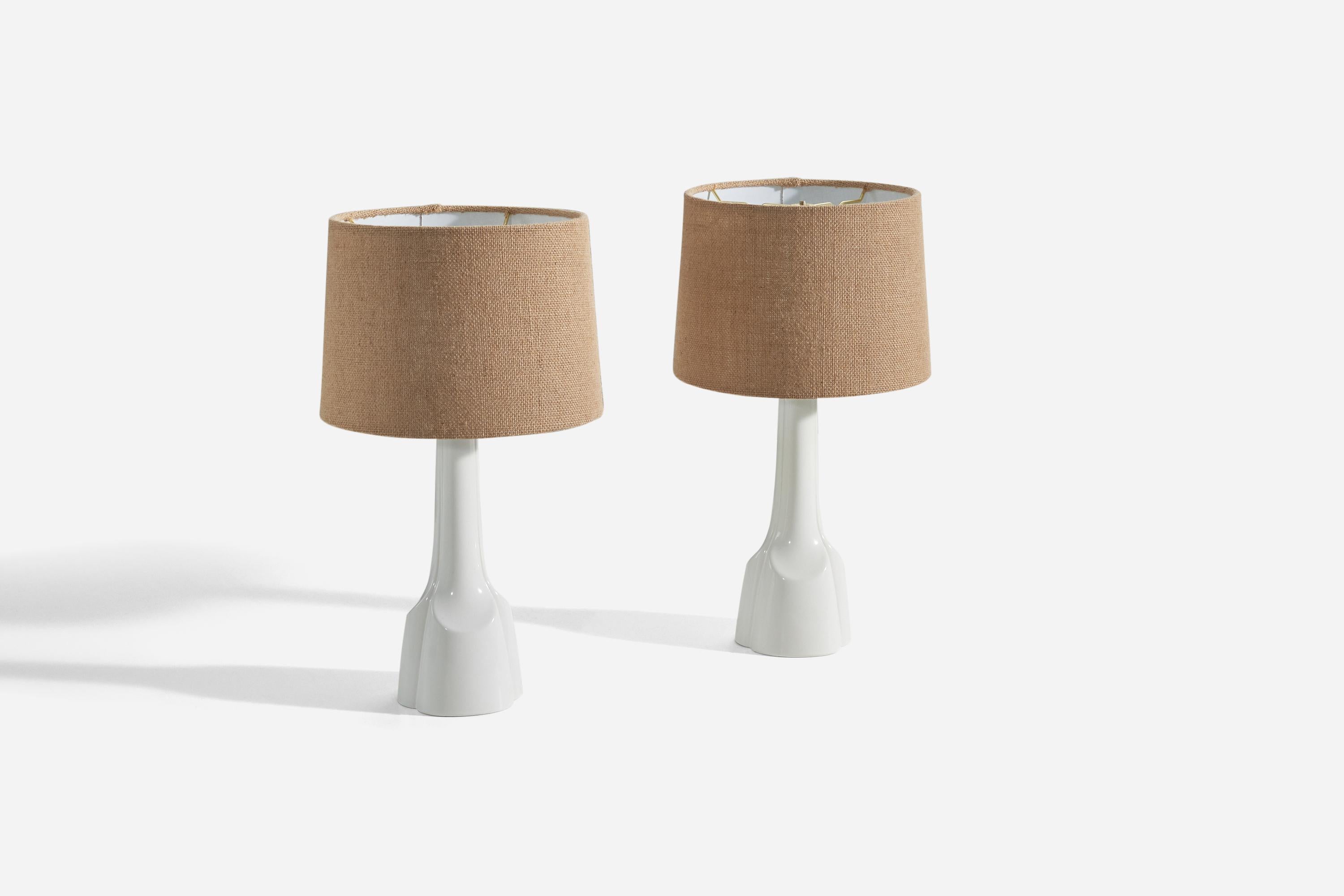A pair of white, glazed stoneware table lamps designed and produced by Søholm Stentøj, Bornholm, Denmark, 1960s. 

Sold without lampshades. 
Dimensions of Lamp (inches) : (14.06 x 4.5 x 4.5) (H x W x D)
Dimensions of Shade (inches) : (9 x 10 x